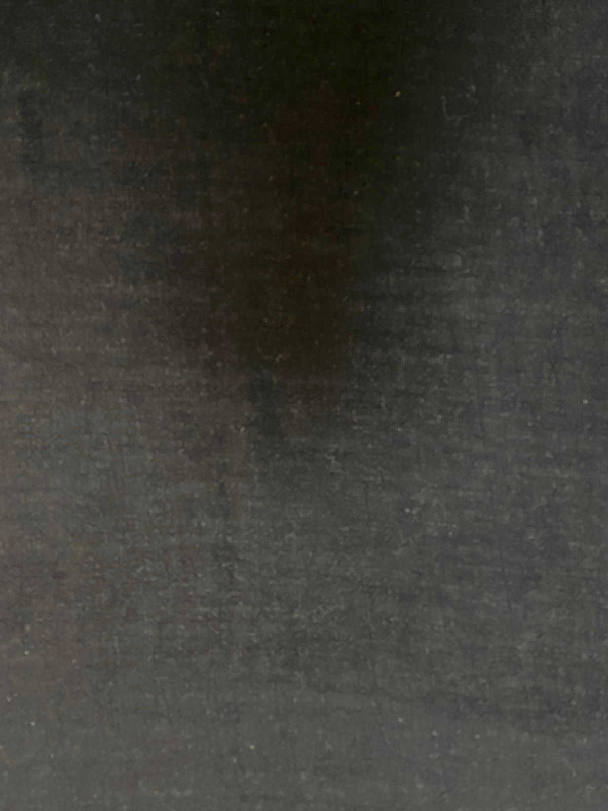 A flat fabric detail highlighting the texture and deep black tone.