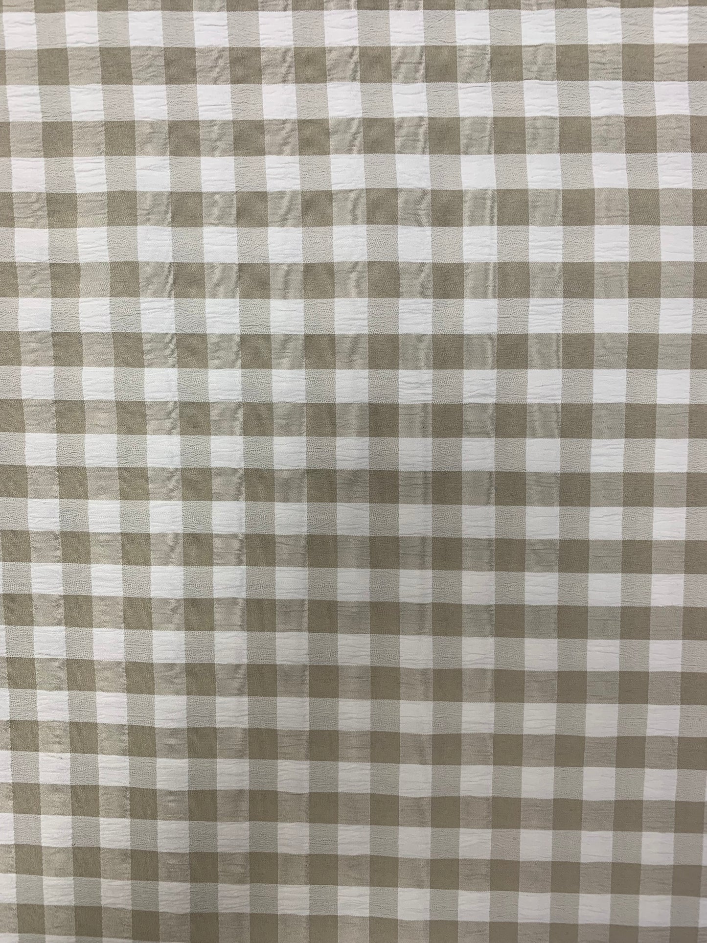 Grey and White gingham fabric is shown in close-up