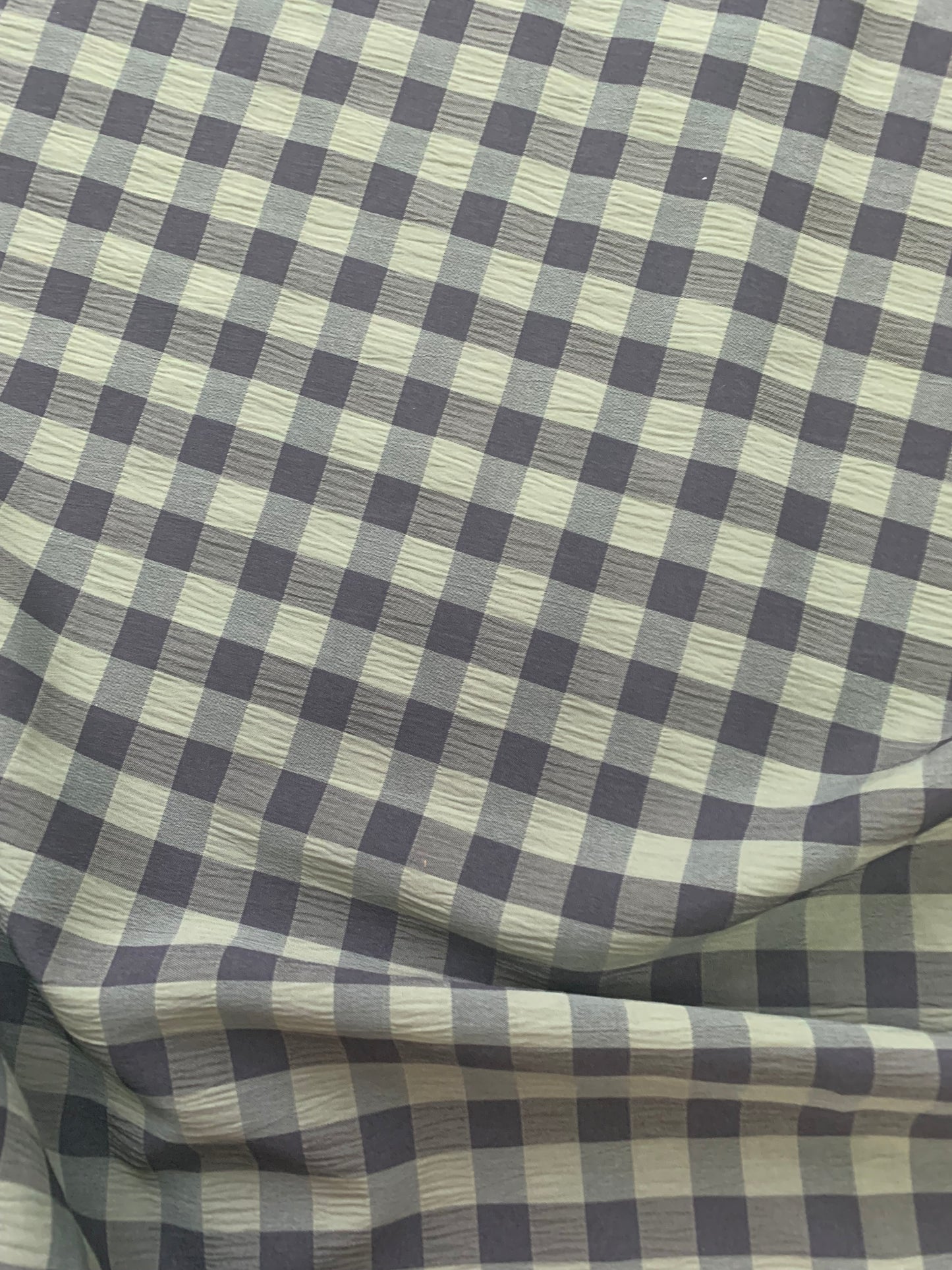 Black and Olive gingham fabric is shown in close-up