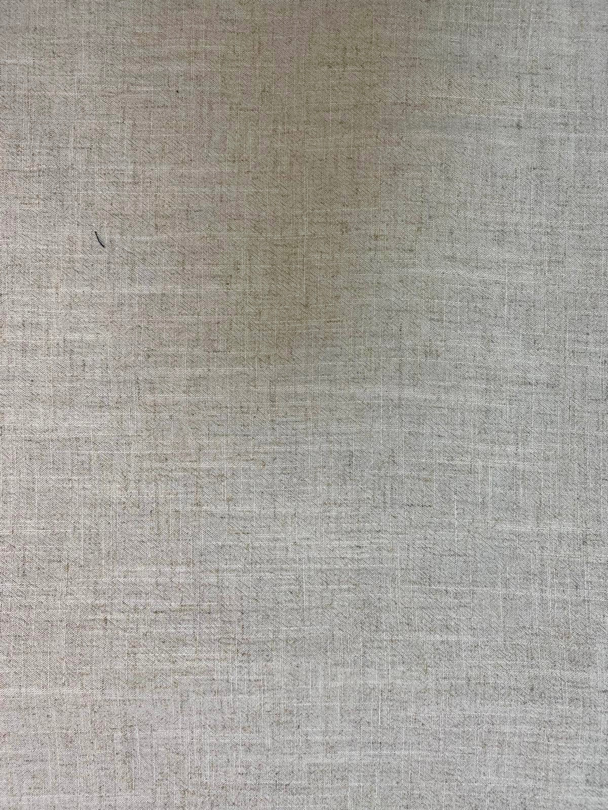 Natural colour fabric laid flat in close detail.