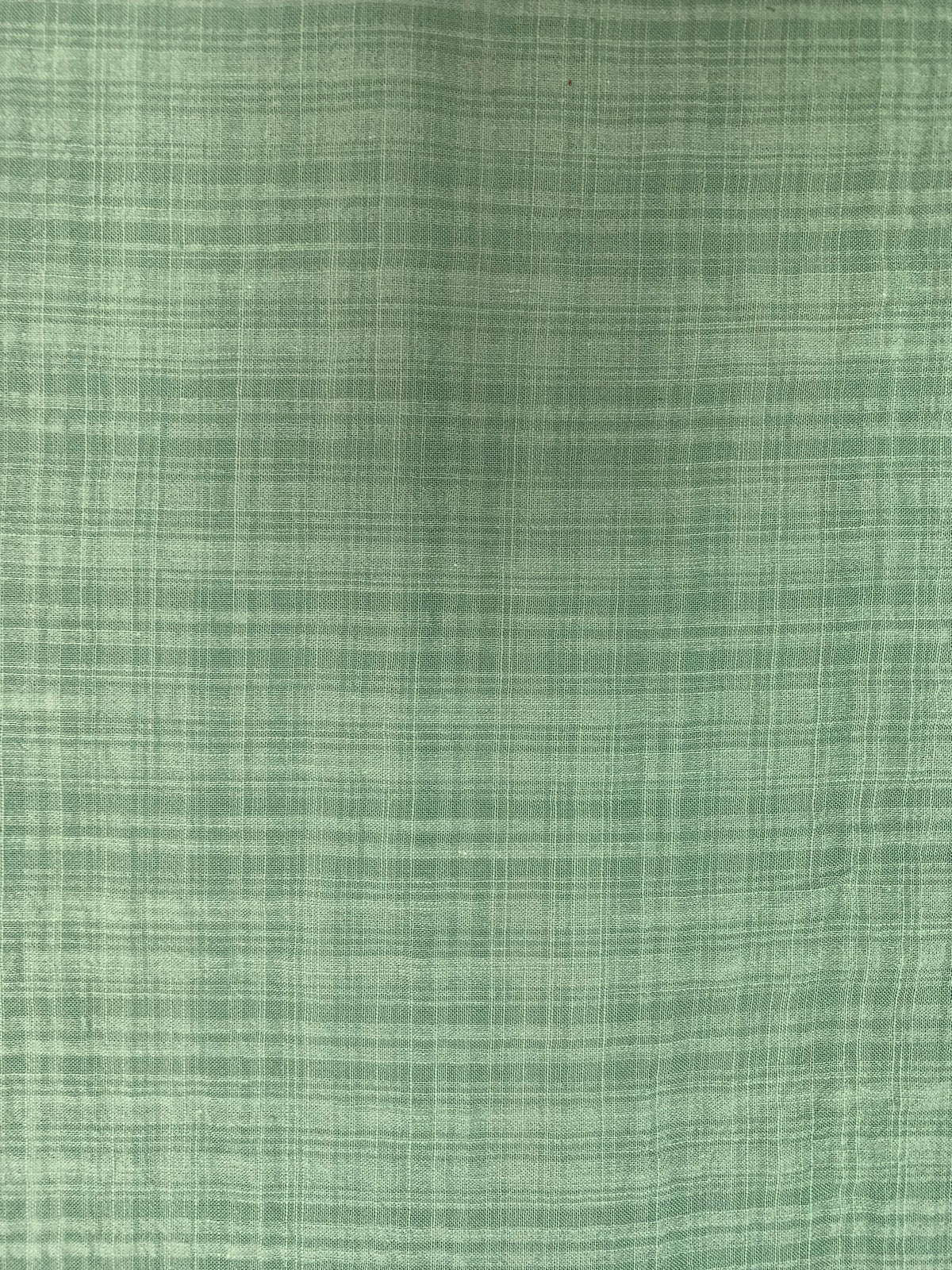 Sage green cotton-viscose blend fabric with a lightweight checked finish.