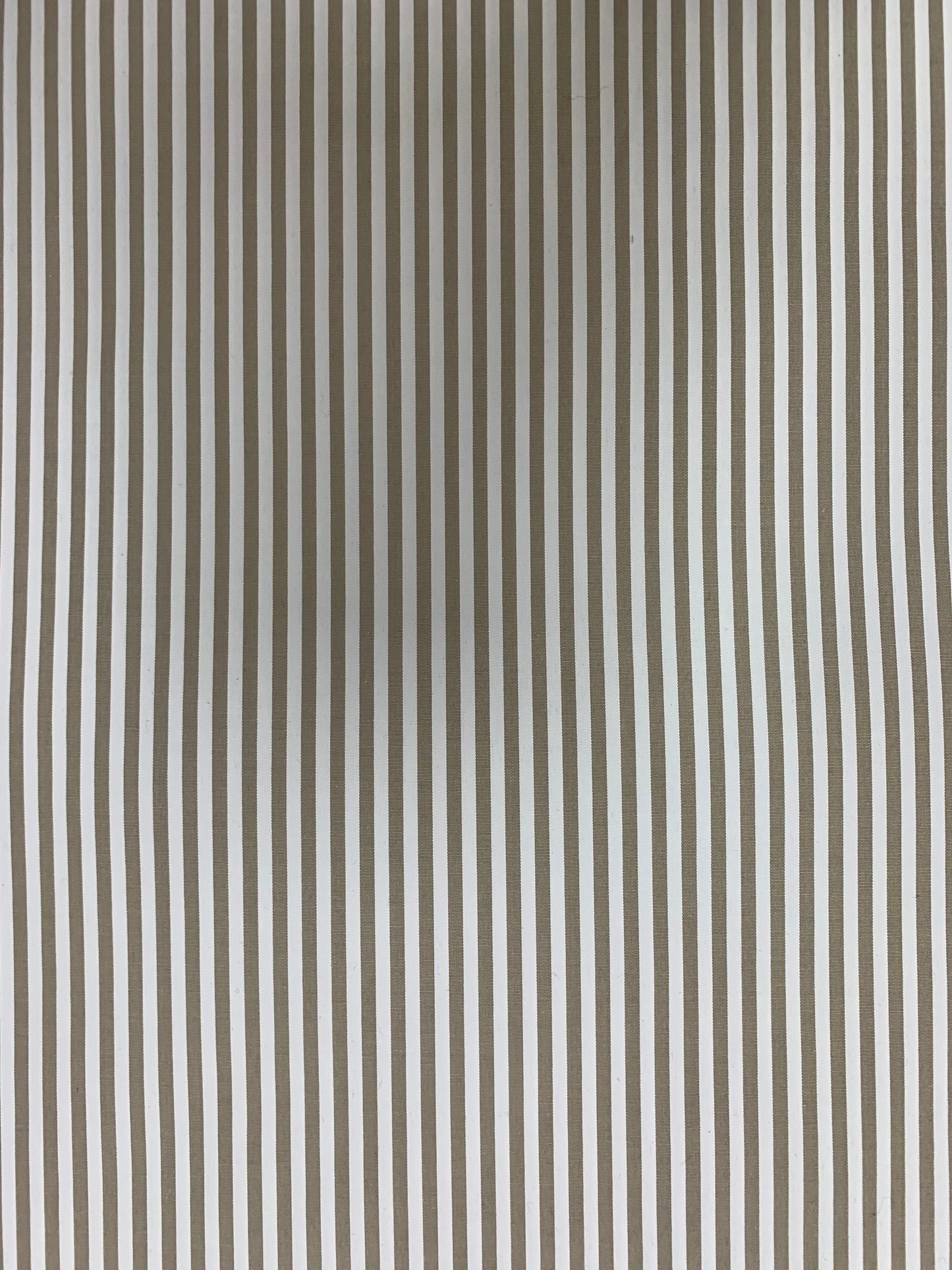 Surface detail of stone-white striped cotton-blend shirting.