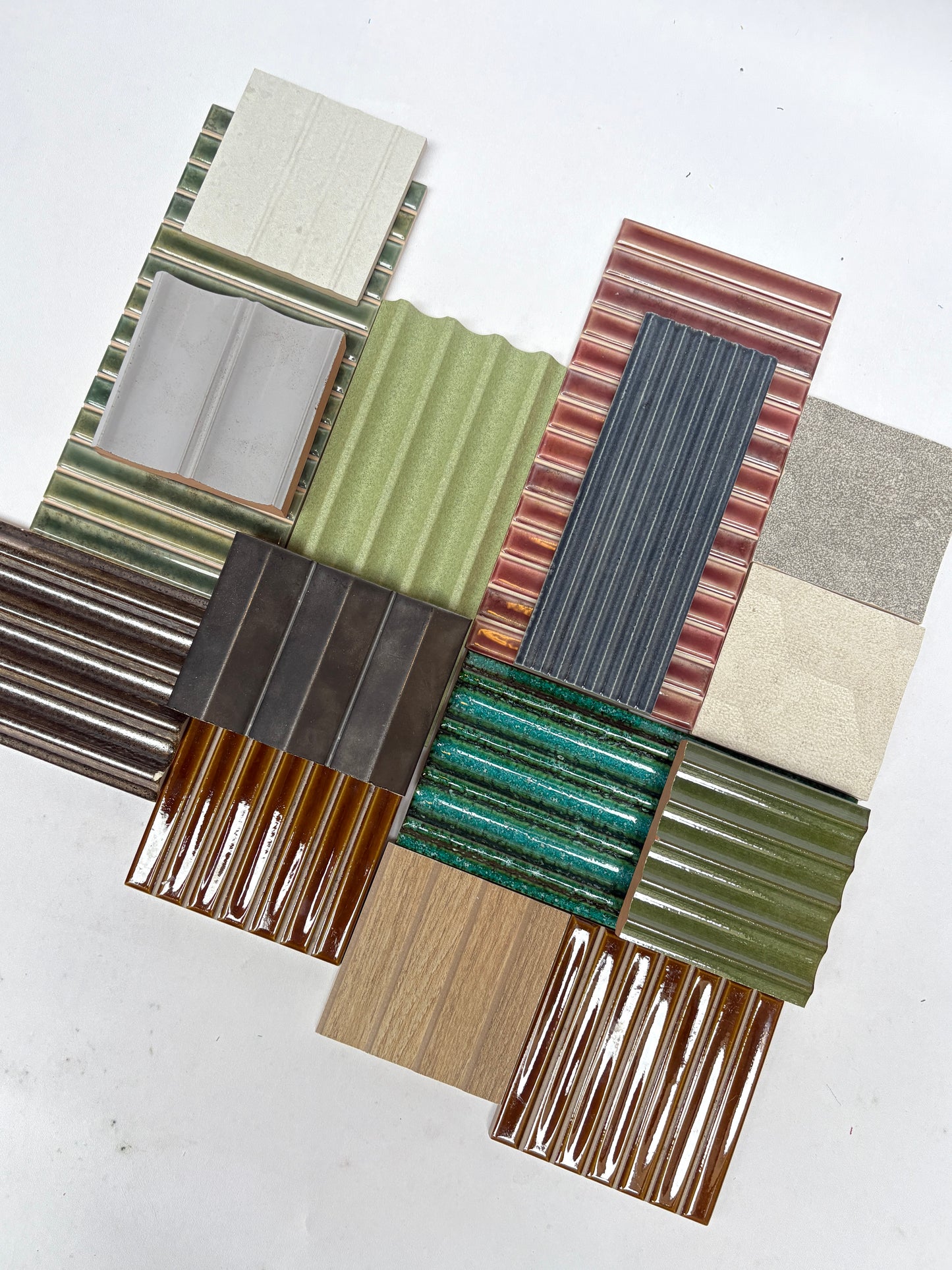 Textured tile samples from a mixed bundle displayed neatly on white.