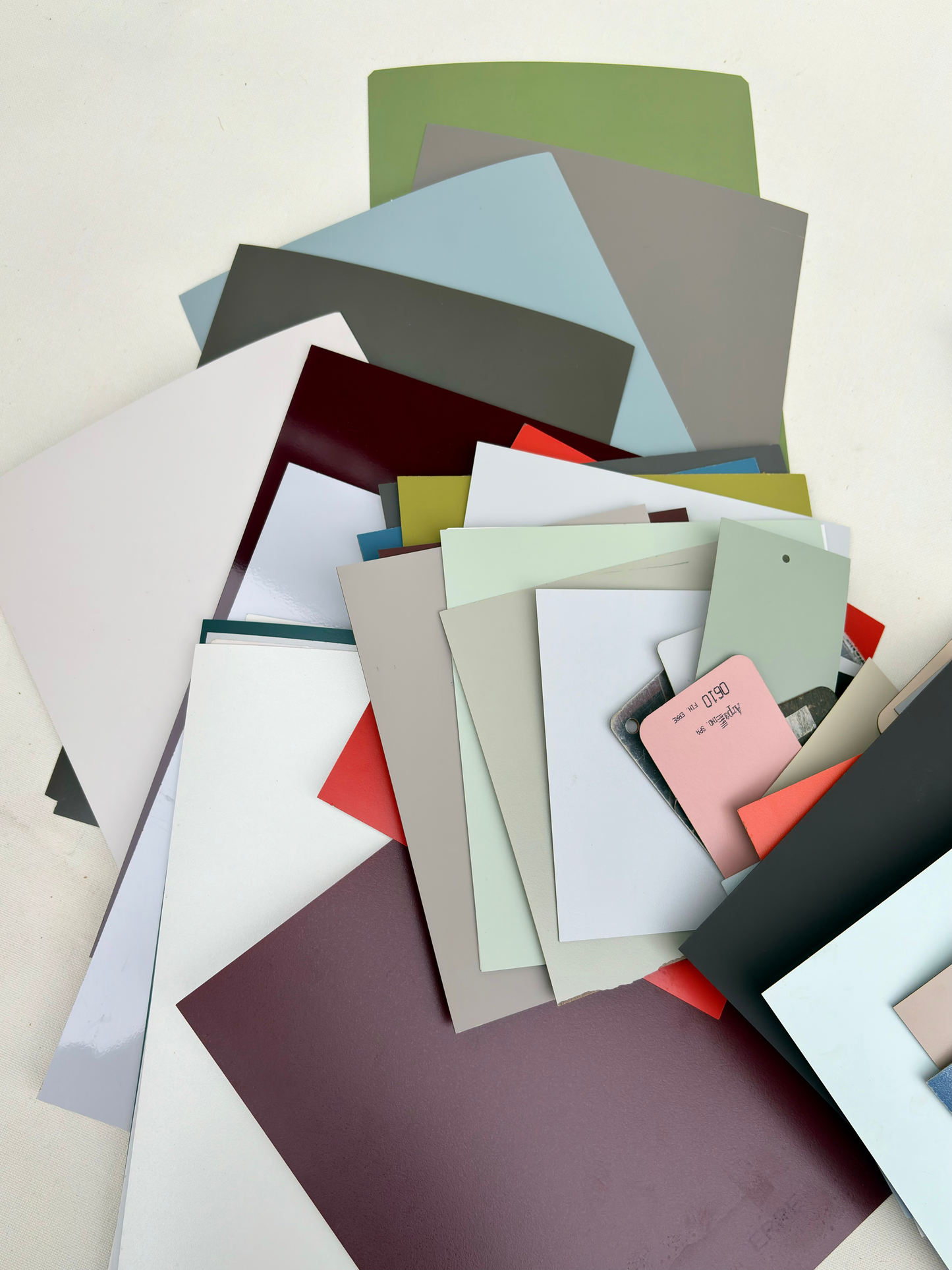 Rectangular sample pieces are arranged in a stacked bundle on white
