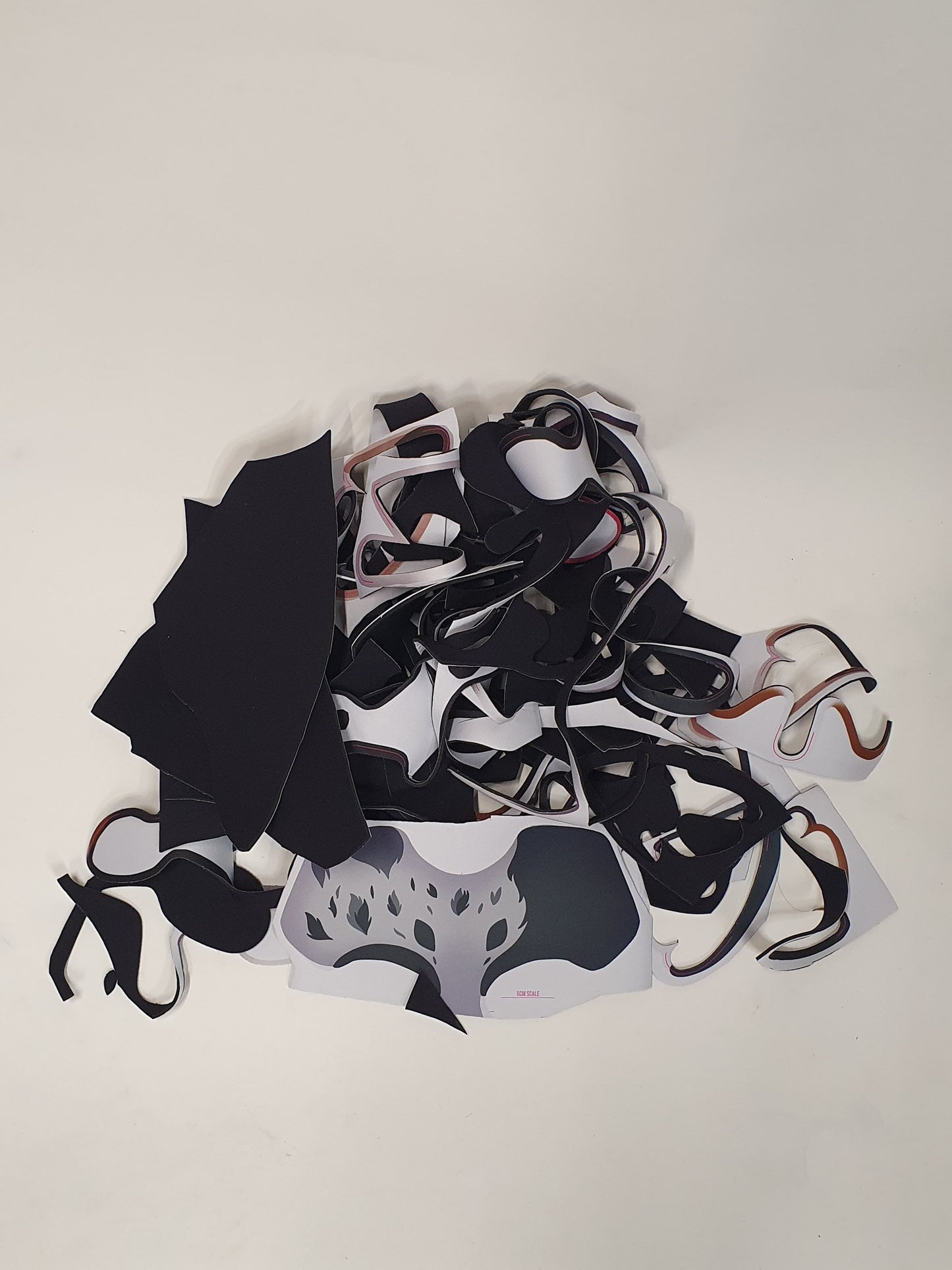 Mixed cut material pieces are shown in a loose layered bundle