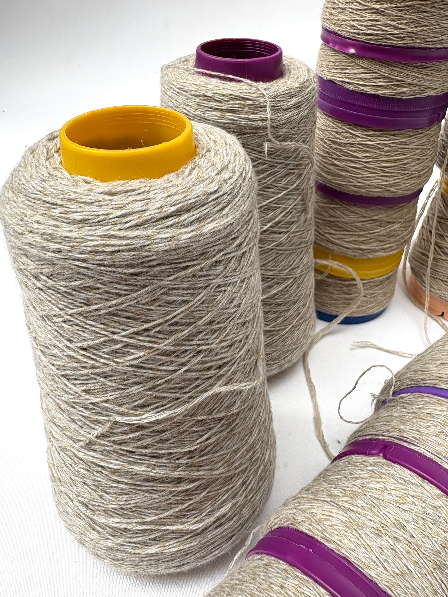Mixed thread cones in details are arranged on a white background
