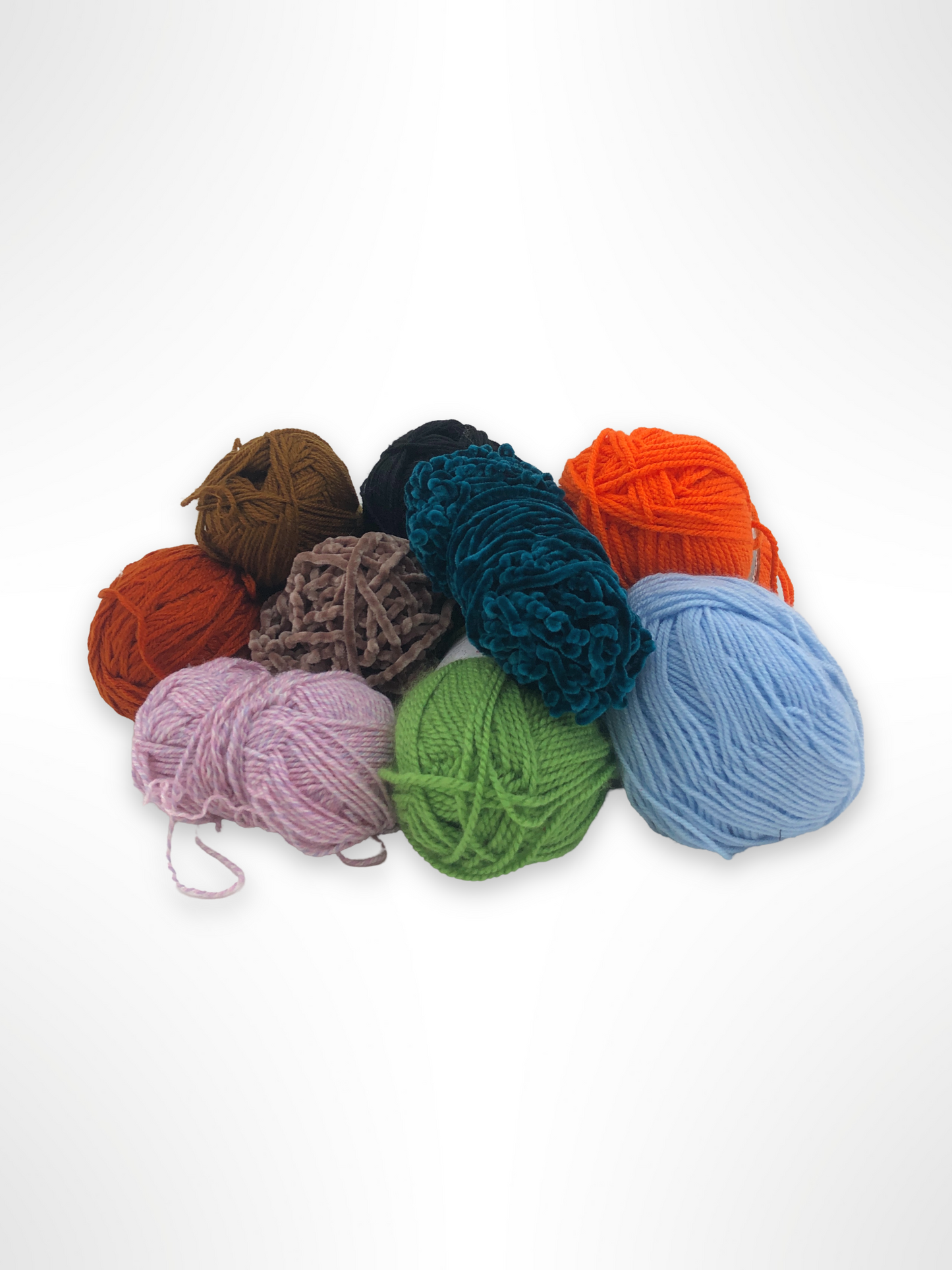 Mixed yarn balls are grouped on a white background