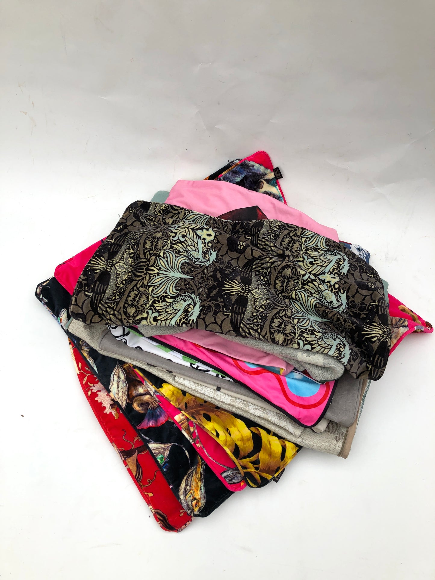 Stack of cushion covers in various patterns and colours