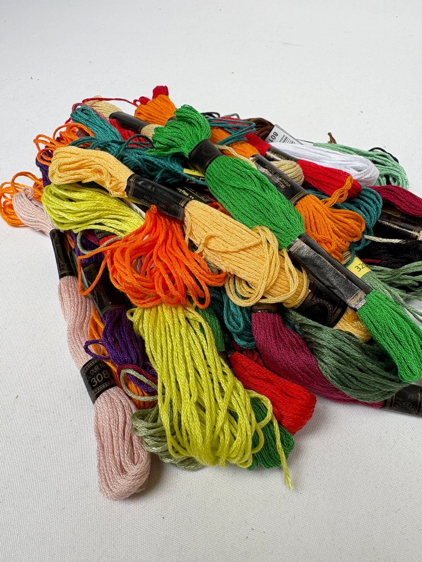 Assorted embroidery floss in many colours is shown together