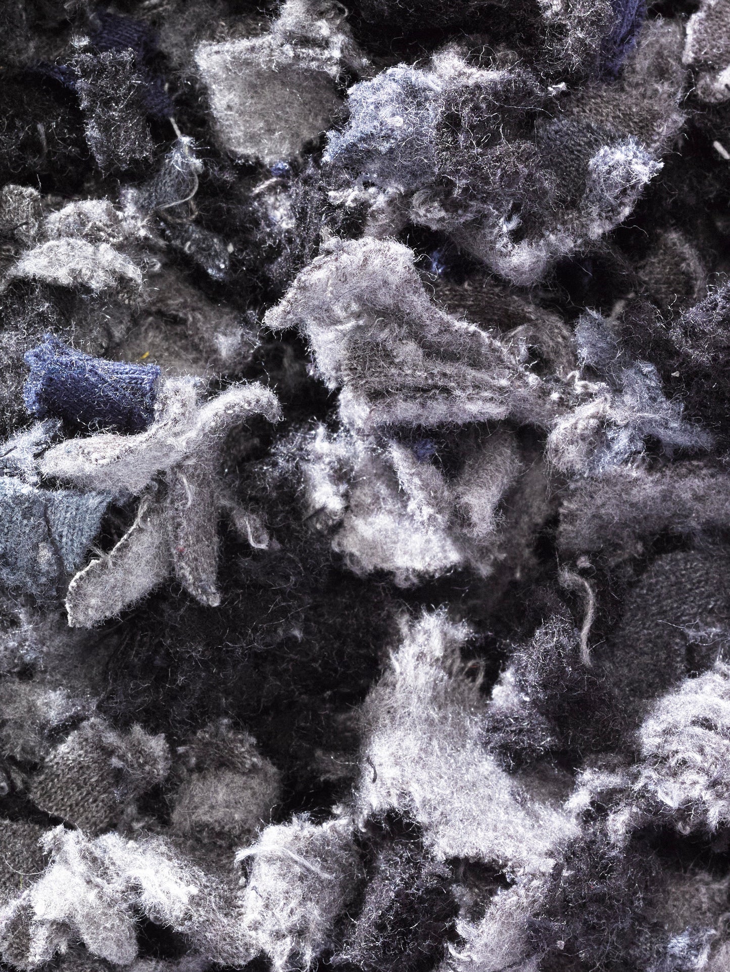 Shredded fibres textiles fabric in black and grey