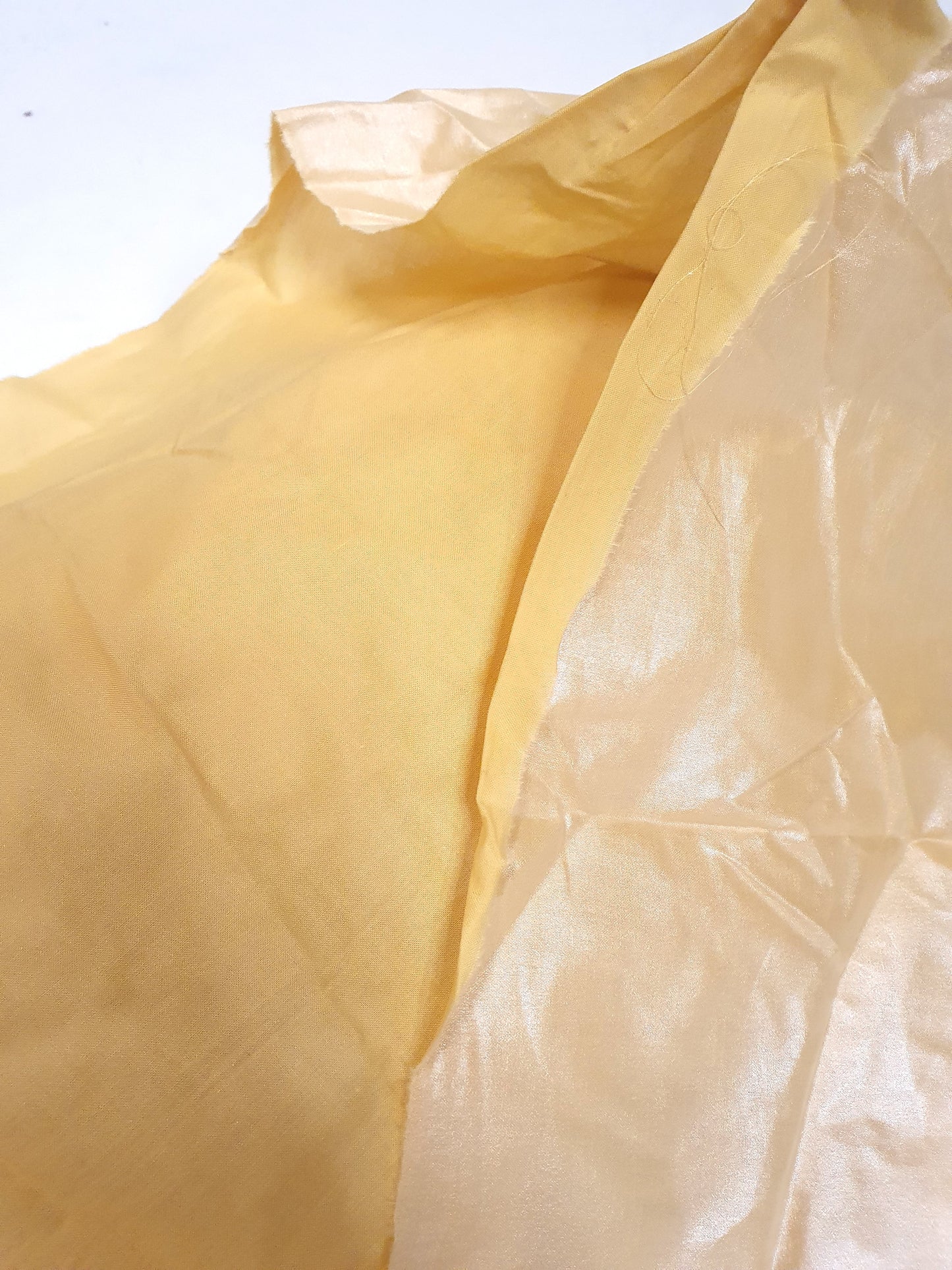 Close-up of water repellent coating light-weight fabric in yellow