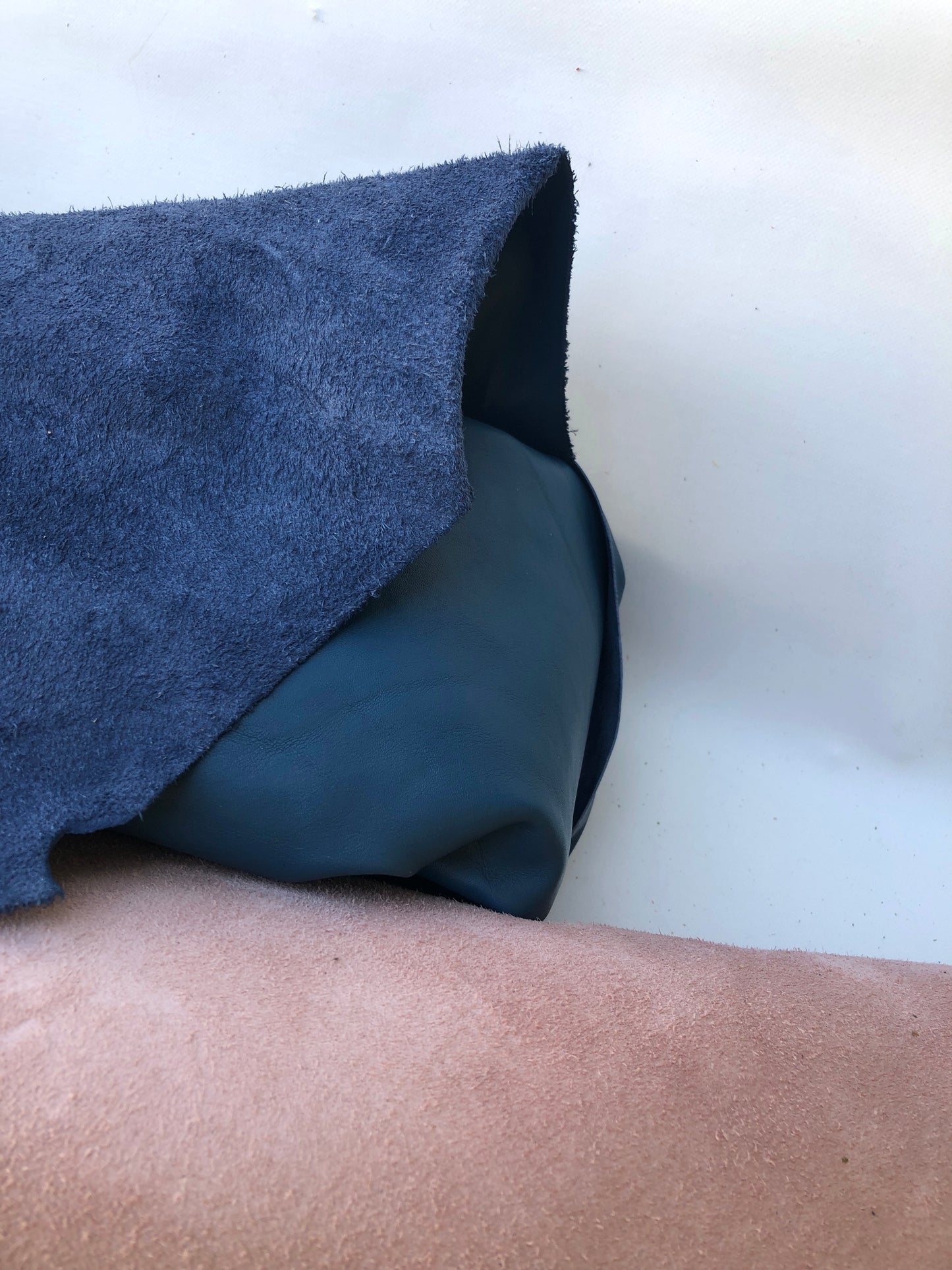 Close-up of blue and pink leather with visible texture