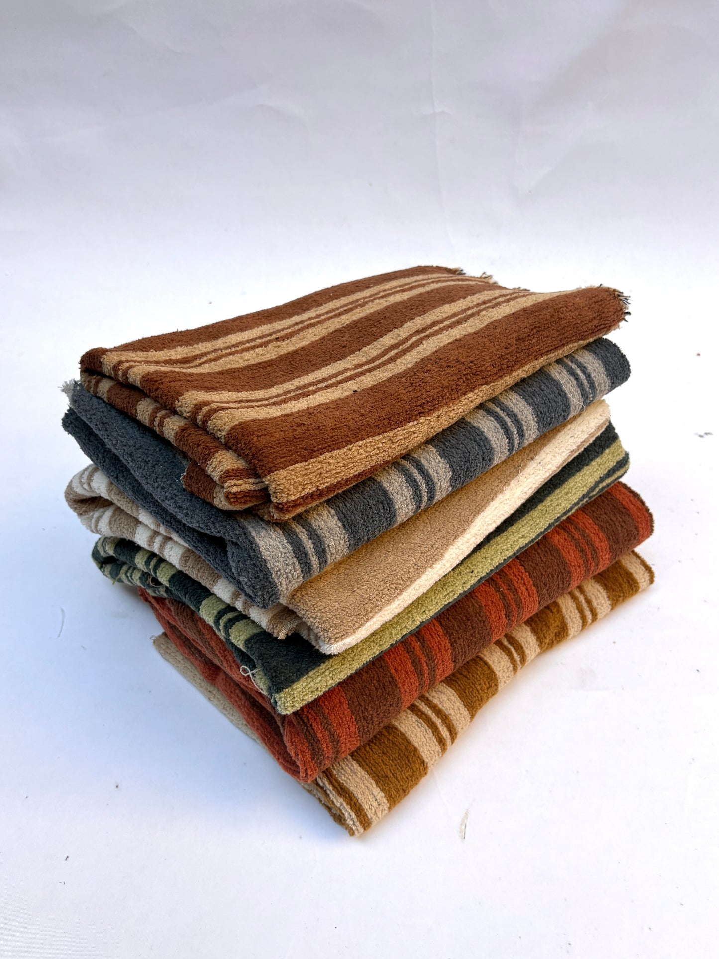 Stack of striped patterned fabric in various colours