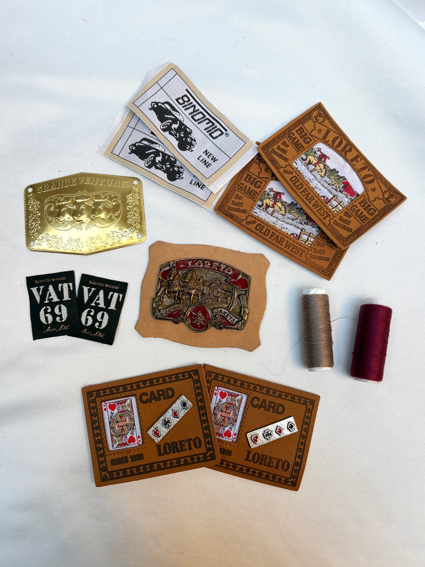 Collection of vintage-style labels and patches on a white background