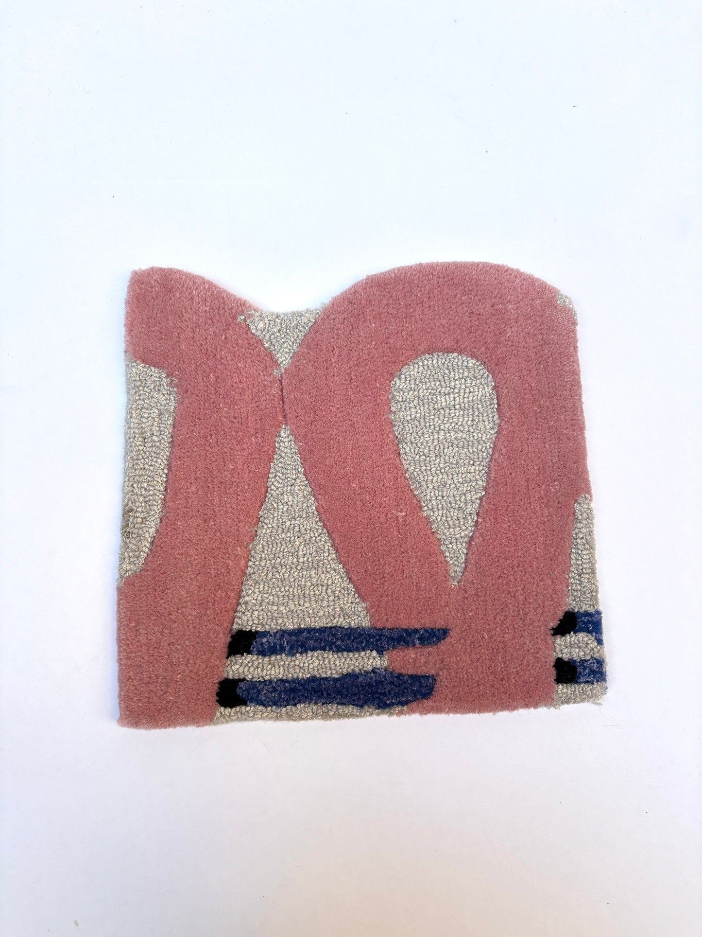 Textured pink and grey abstract patterned rug sample with two purple stripes