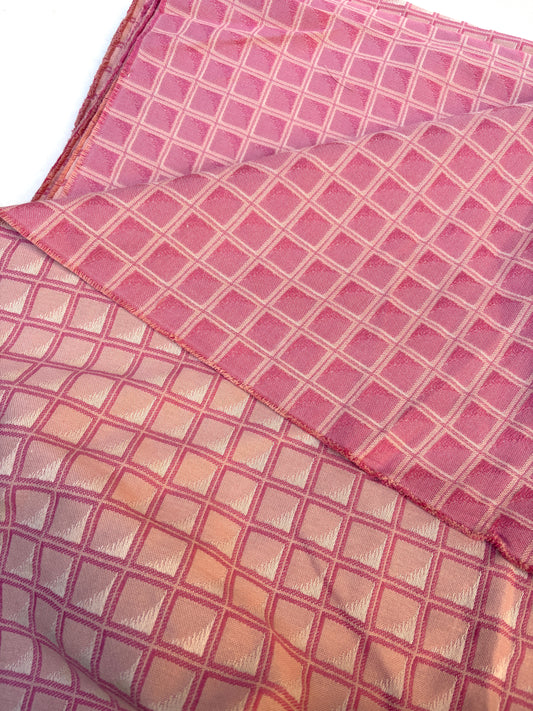 Pink checkered fabric with a subtle pattern