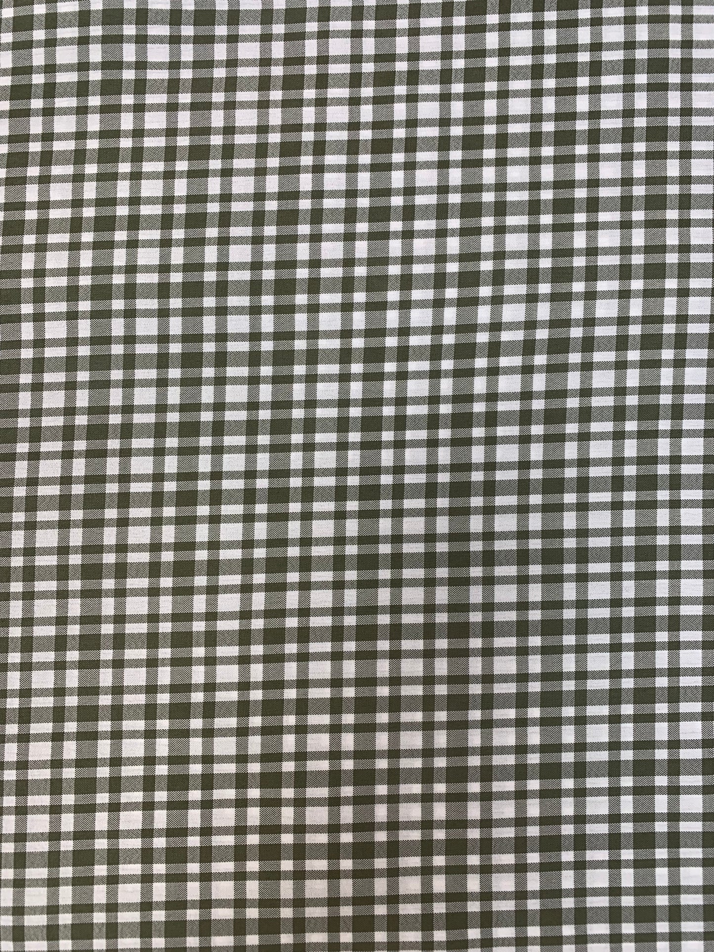Fabric detail showing the khaki and white apple check pattern.