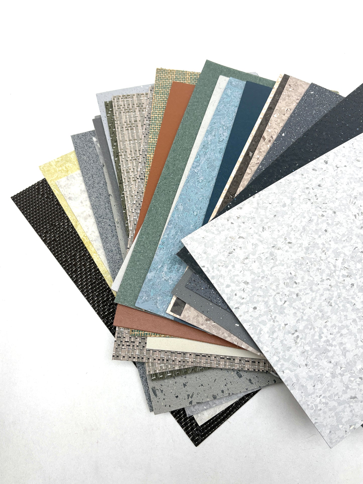 Textured floor samples are fanned out on a white background