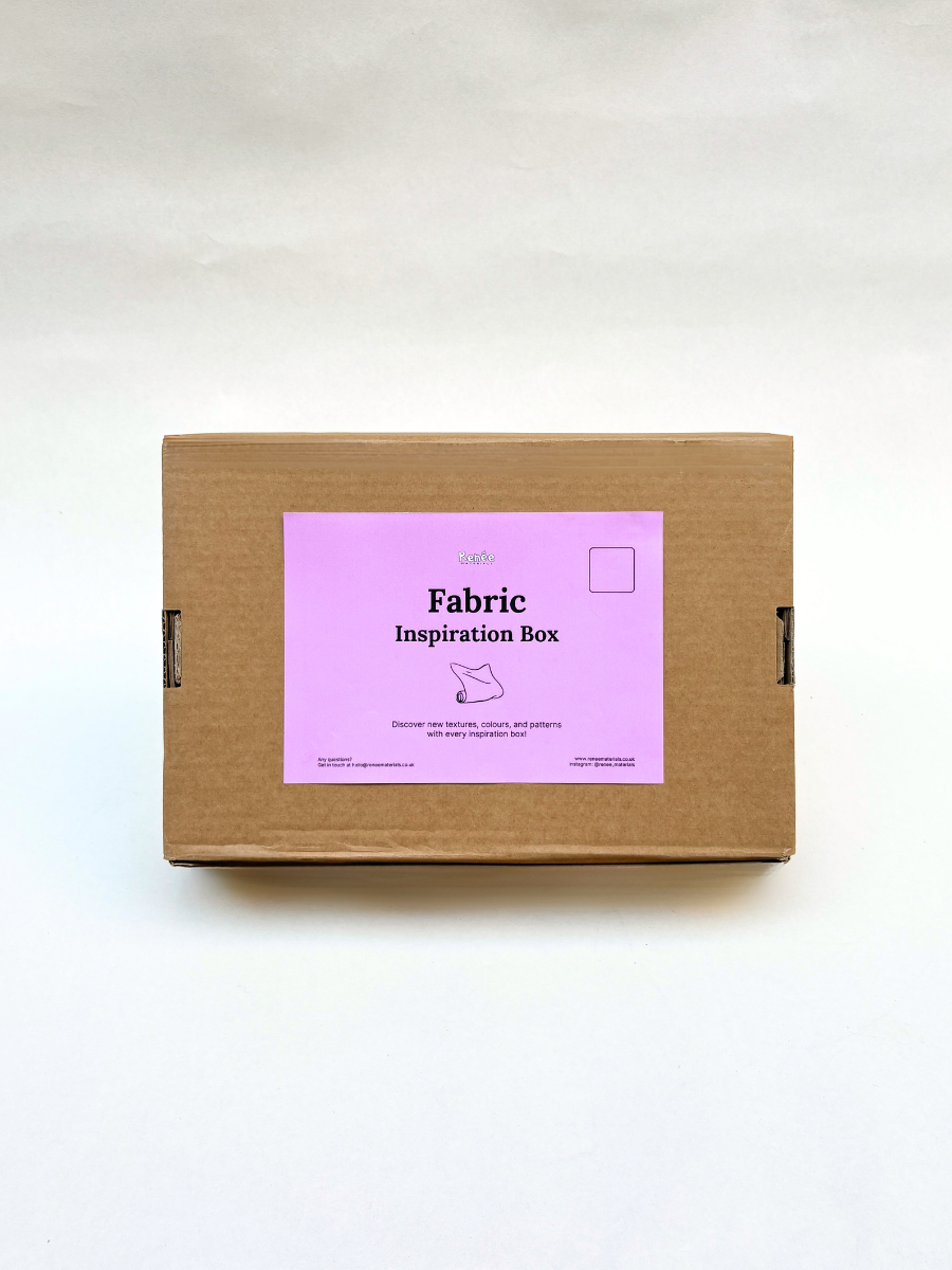 Brown cardboard box with a pink label on a white background