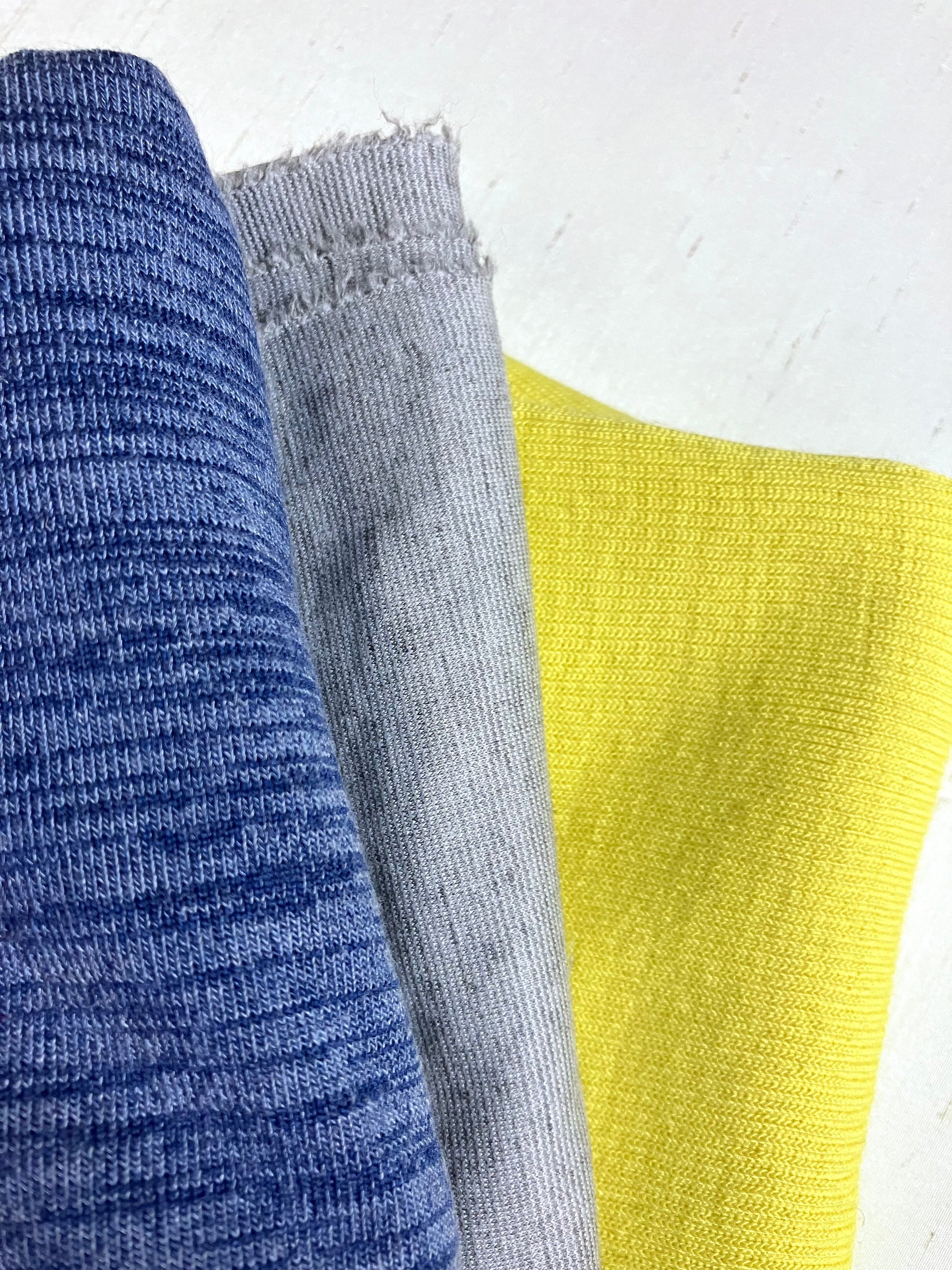 Close-up of jersey fabric with blue, grey, yellow