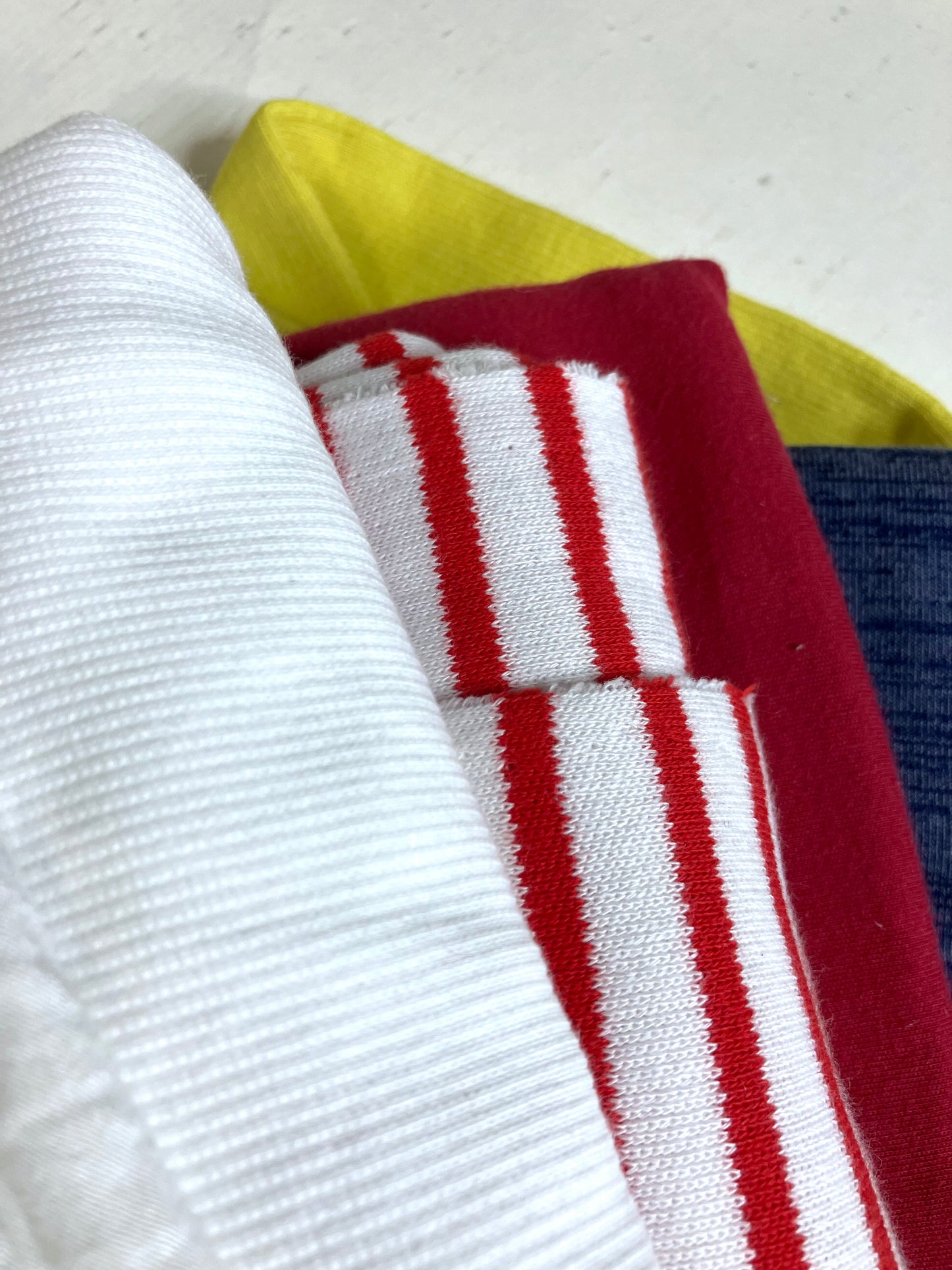 Close-up of colourful jersey fabric with various textures