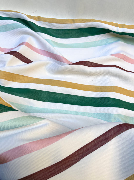 Striped fabric with multicolor pattern on a white background