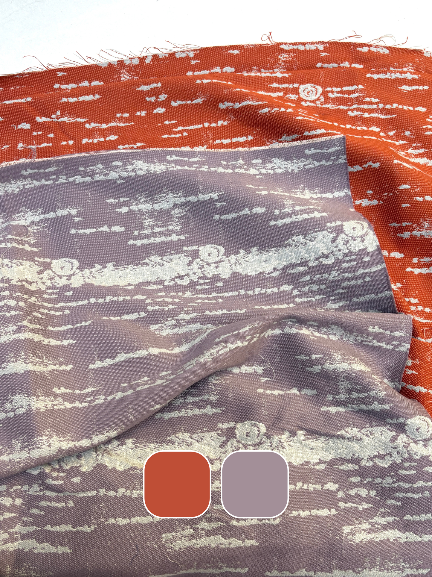 Close-up of silk fabric with red and purple pattern.