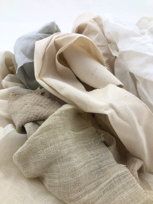 Close-up of natural fabric in neutral colors on a light background
