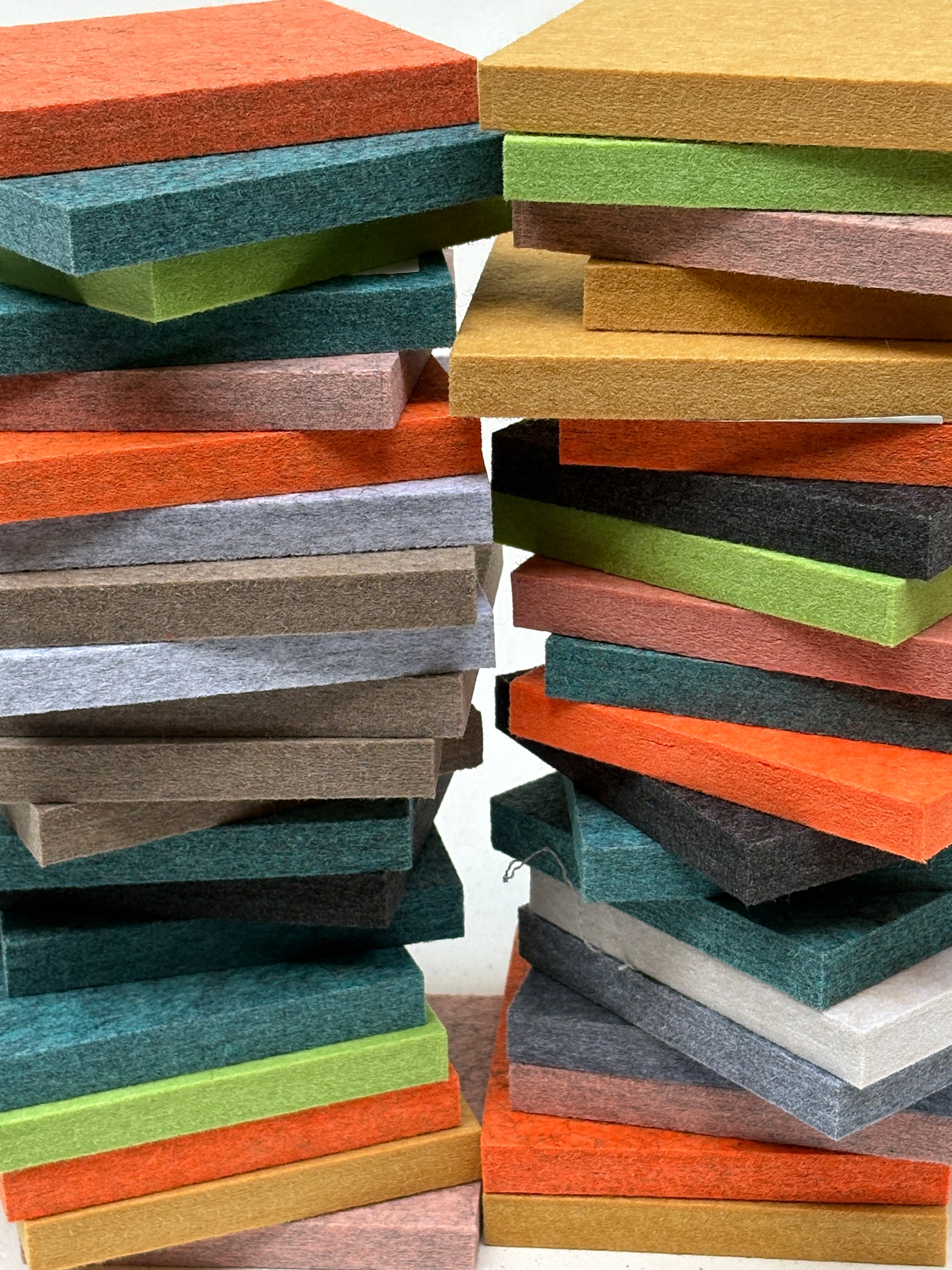 Close-up view shows felt tiles in many colours and layered edges
