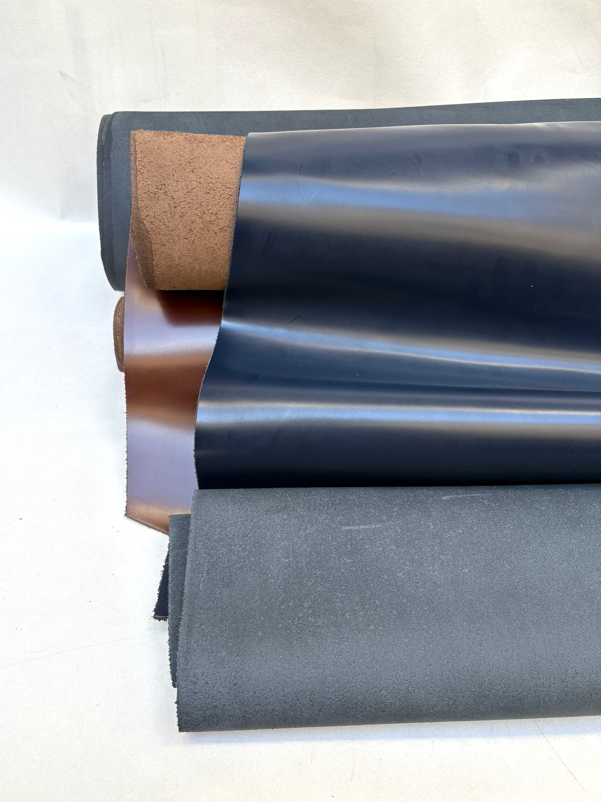     Blue, grey, and brown material sheets are shown folded in detail.