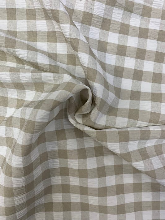 Grey and White checked fabric is gathered into soft folds