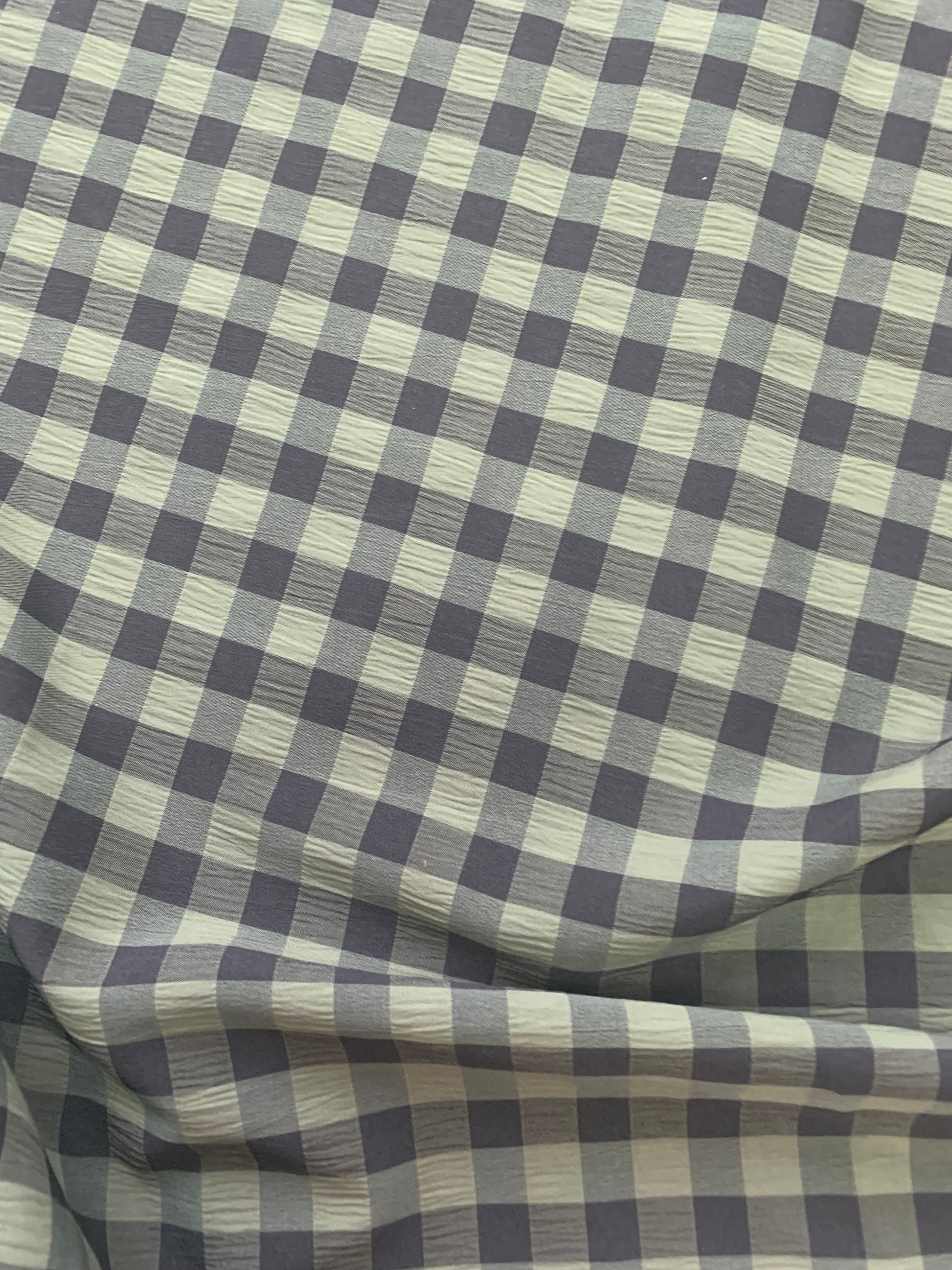 Black and Olive gingham fabric is shown in close-up