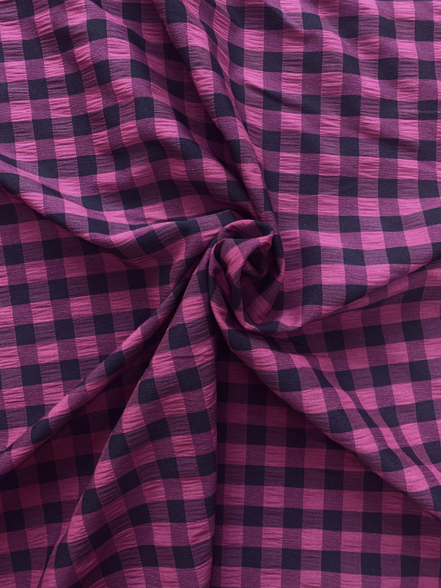 Black and Purple gingham fabric is shown in close-up
