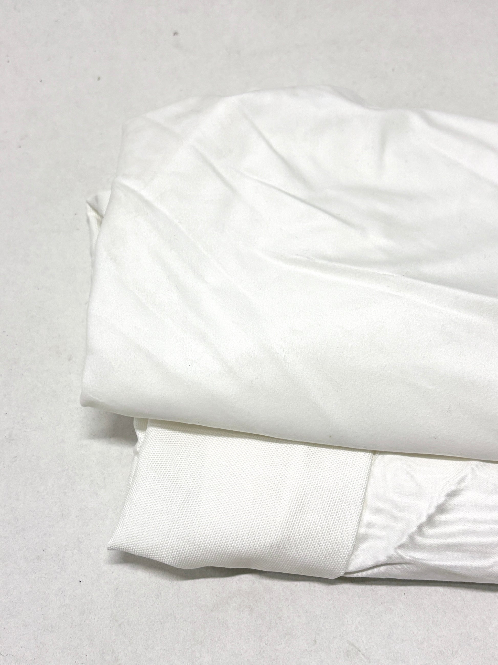 White fabric on a light gray background