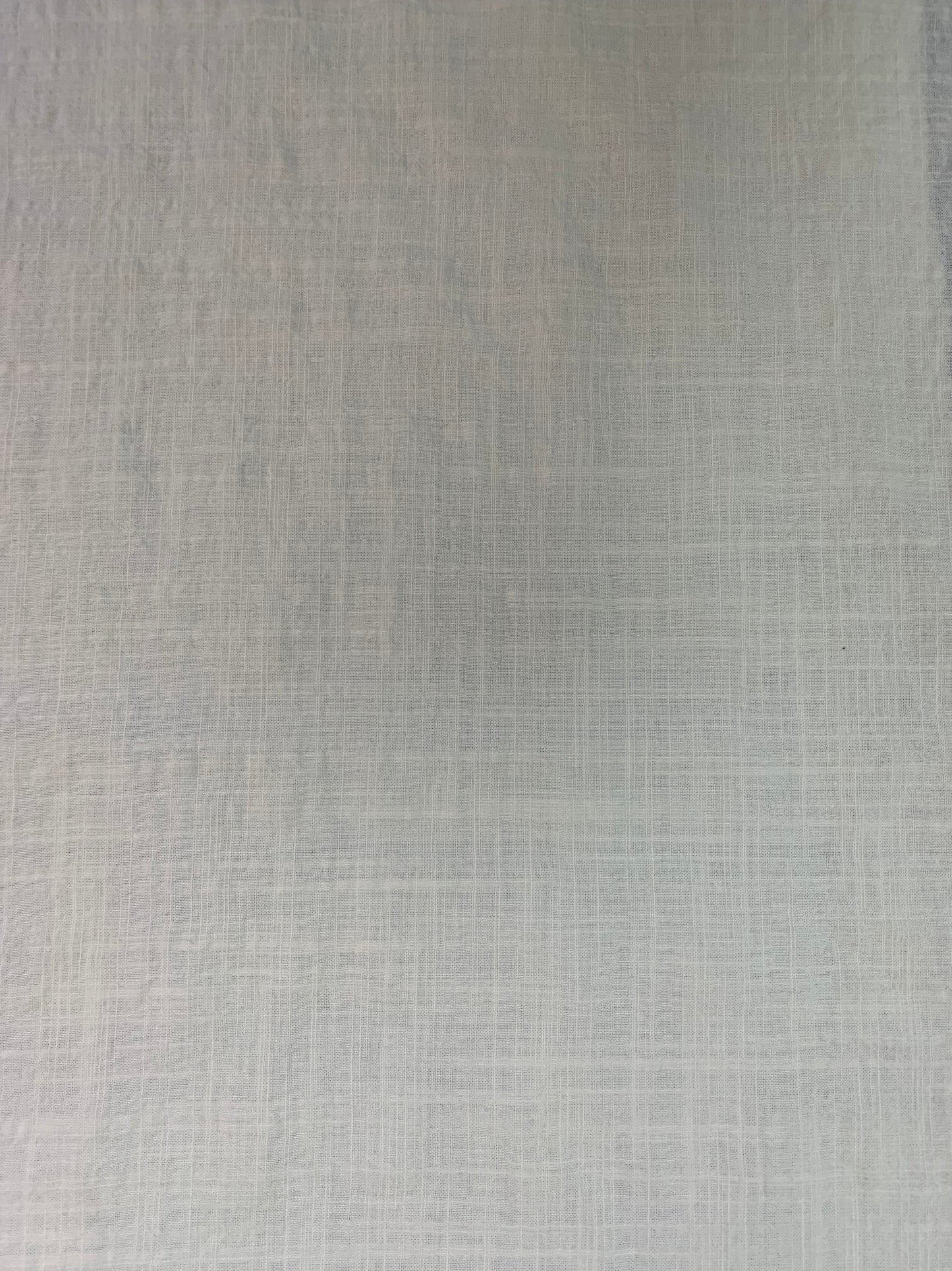 A textured fabric view capturing the soft structure of this ivory cloth.