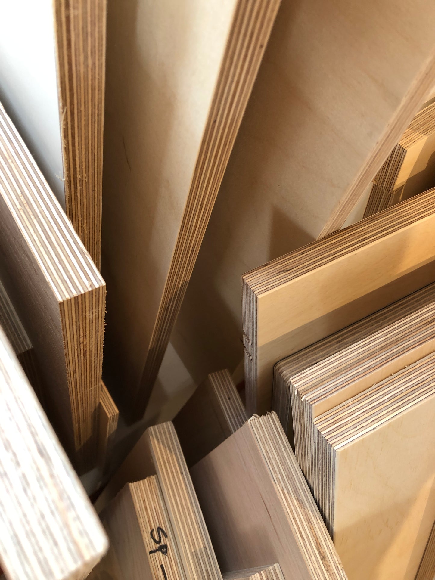 Two bags of collection of various-sized off-cut plywood