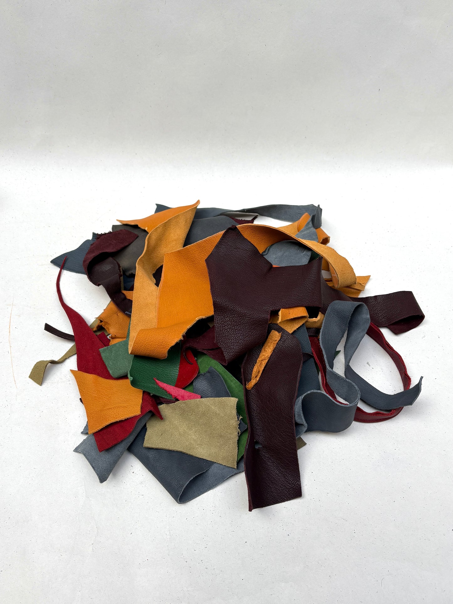 Close-up views show offcuts in many colours, shapes, and textures