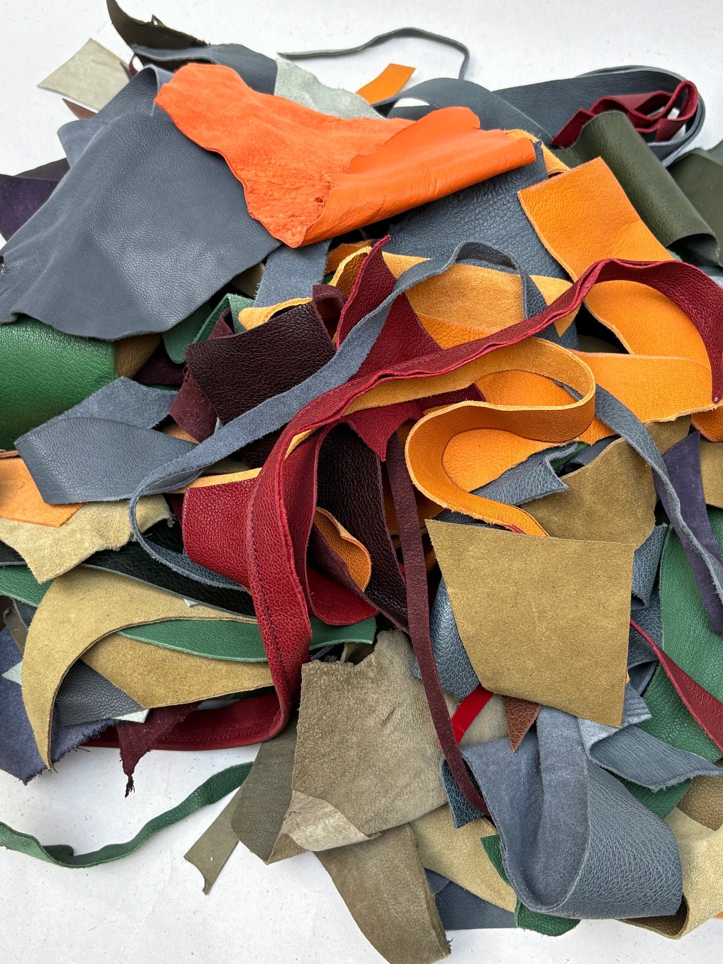 Small material scraps are grouped together in piled and detailed views