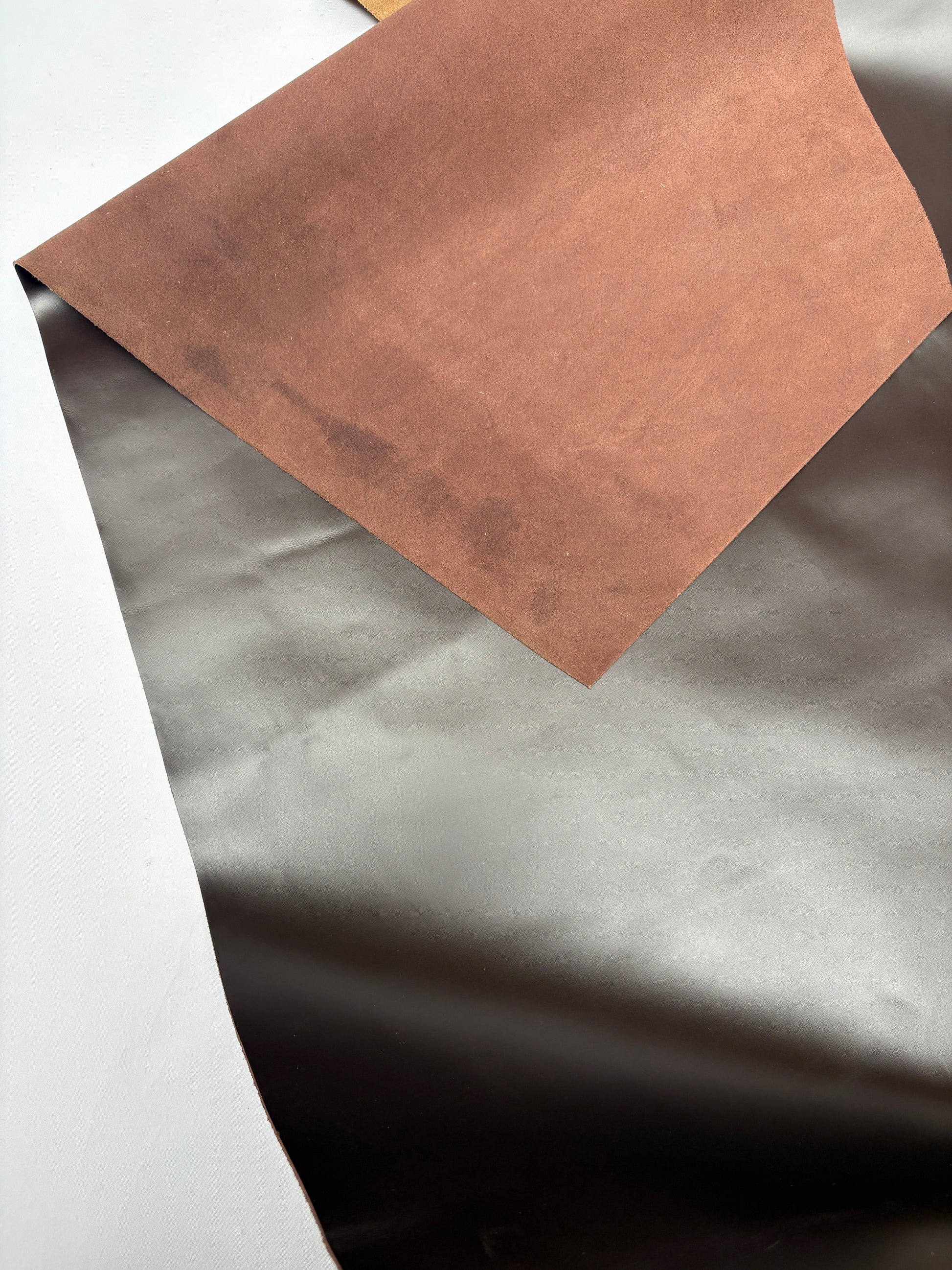 Dark brown leather on a white background