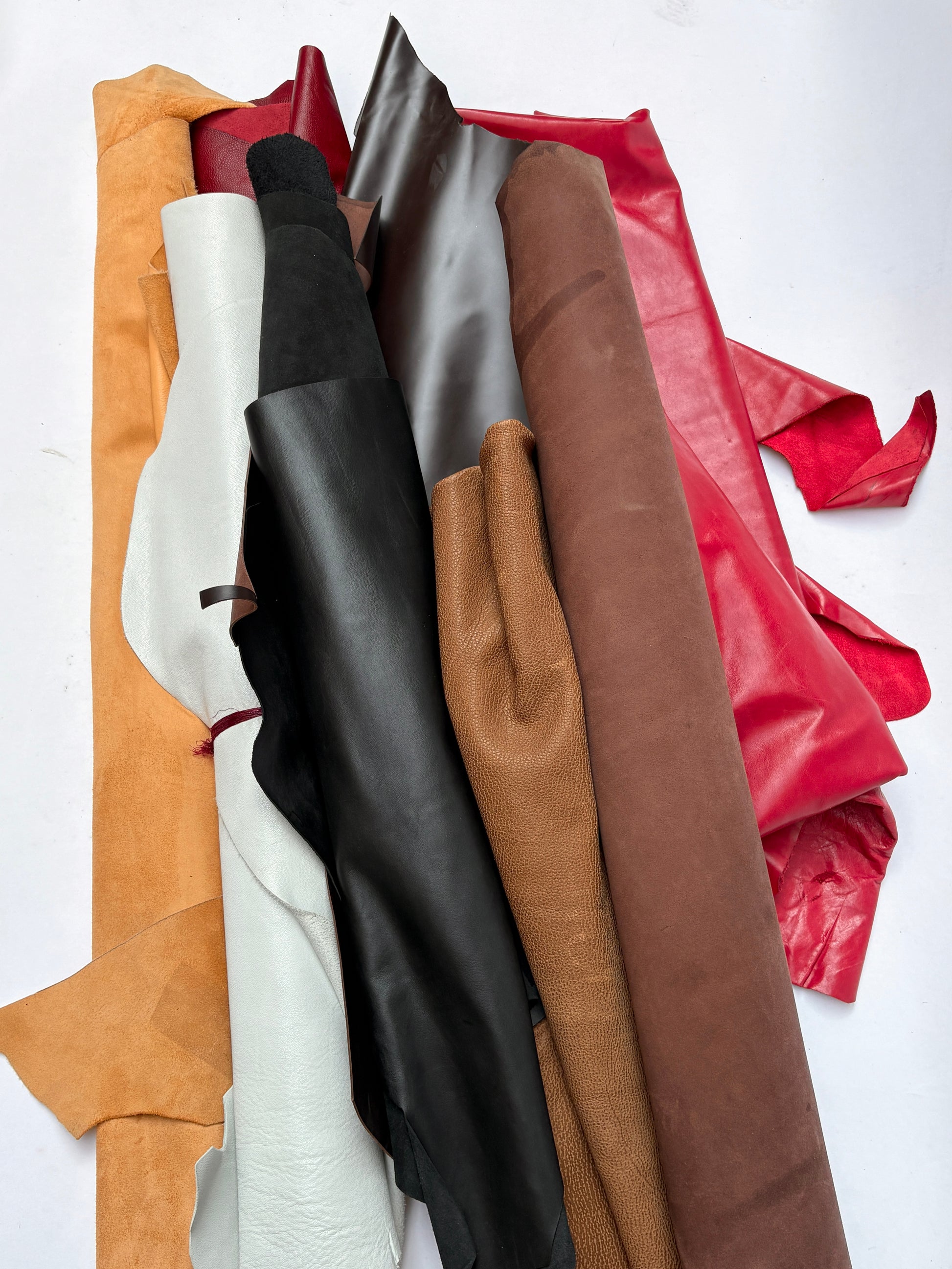 Collection of leathers in various colors on a white background