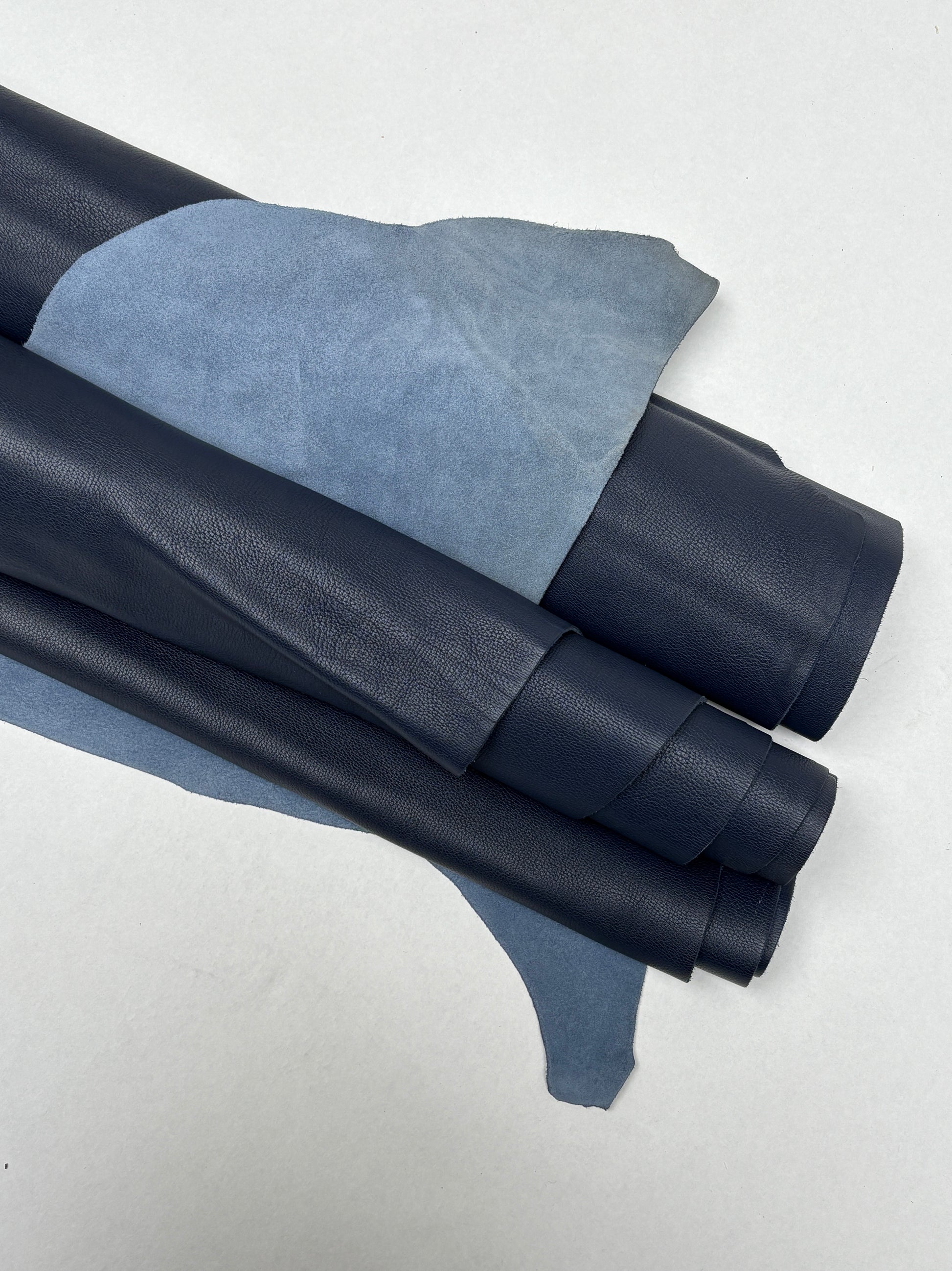 Blue leather rolls surface is shown with fine natural creases