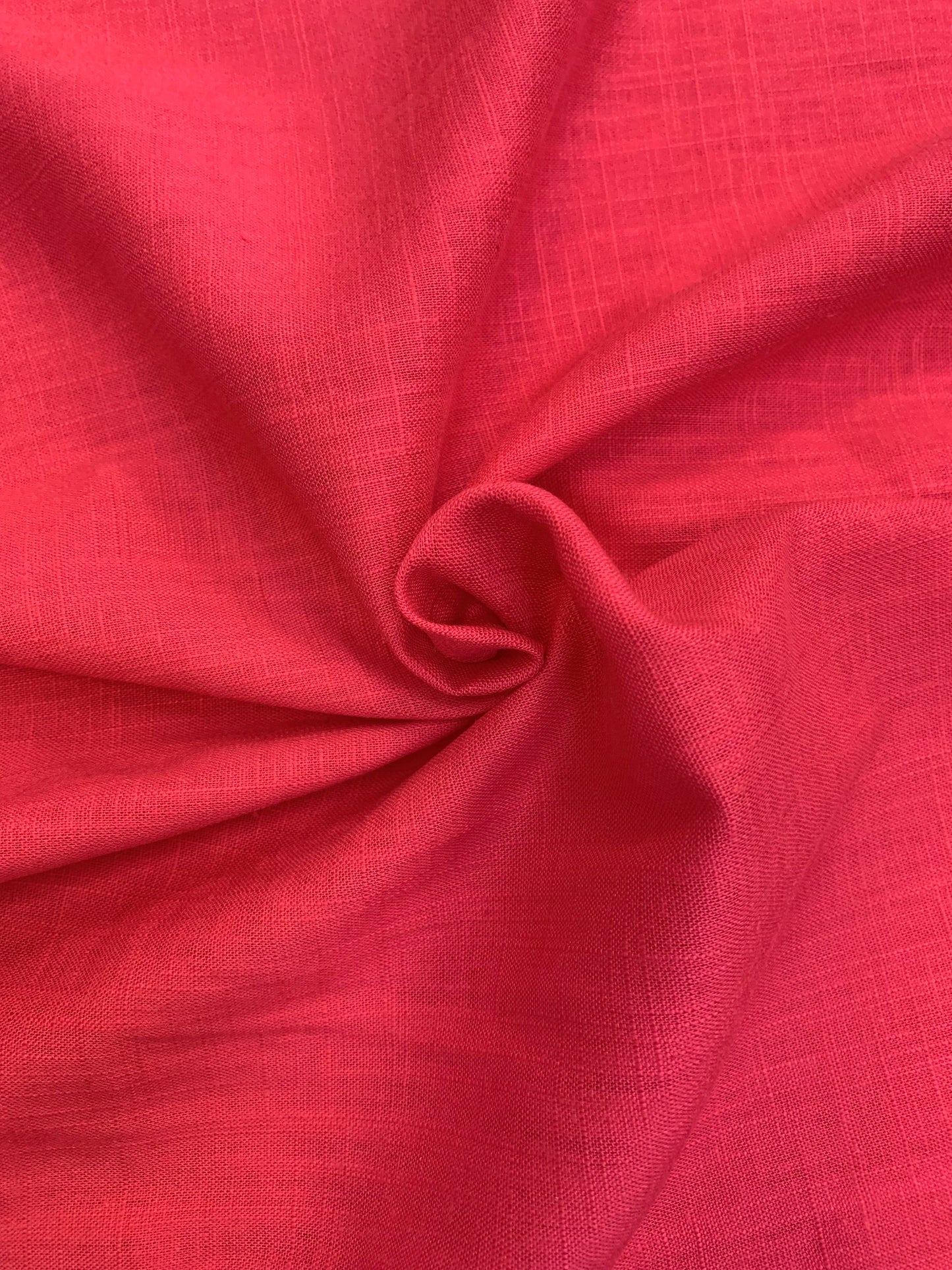 Lipstick pink viscose linen deadstock fabric shown with a natural textured finish.