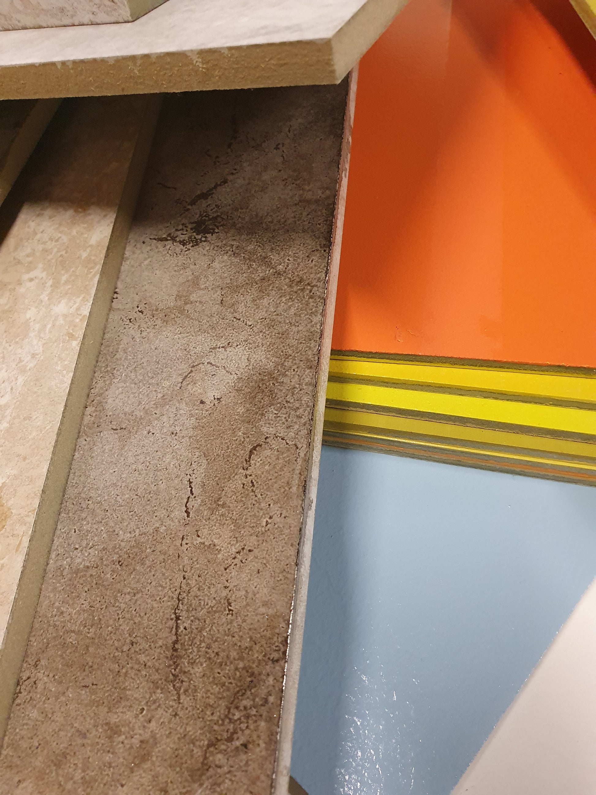 Rectangular sample pieces are arranged in grouped and layered stacks