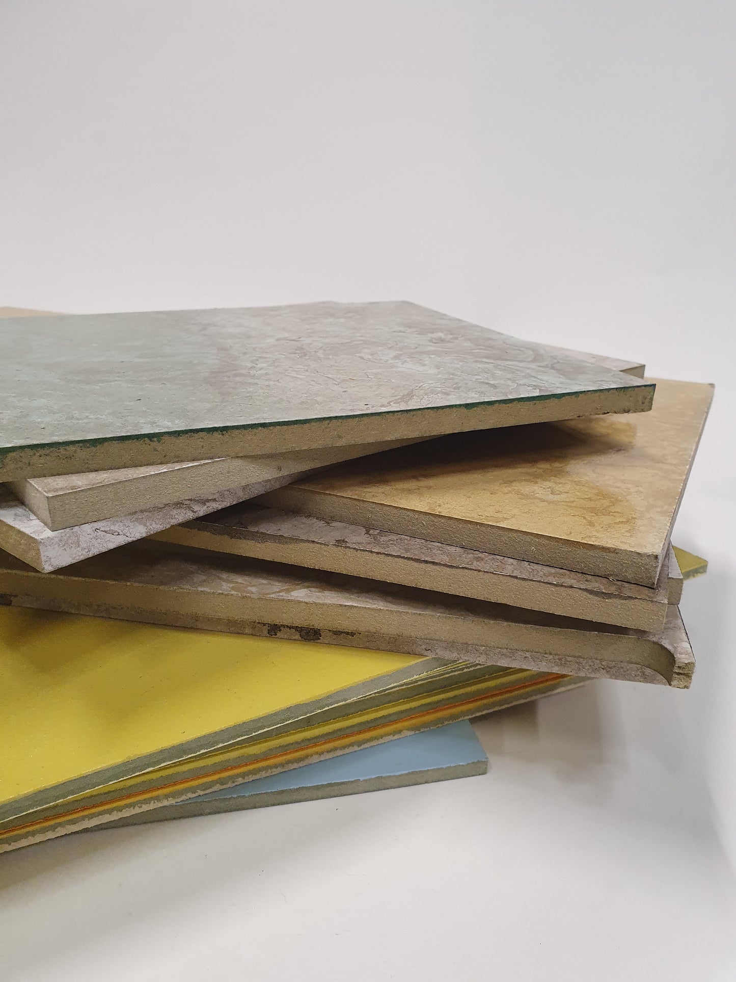 Flat sample sheets are shown in different colours, textures, and finishes