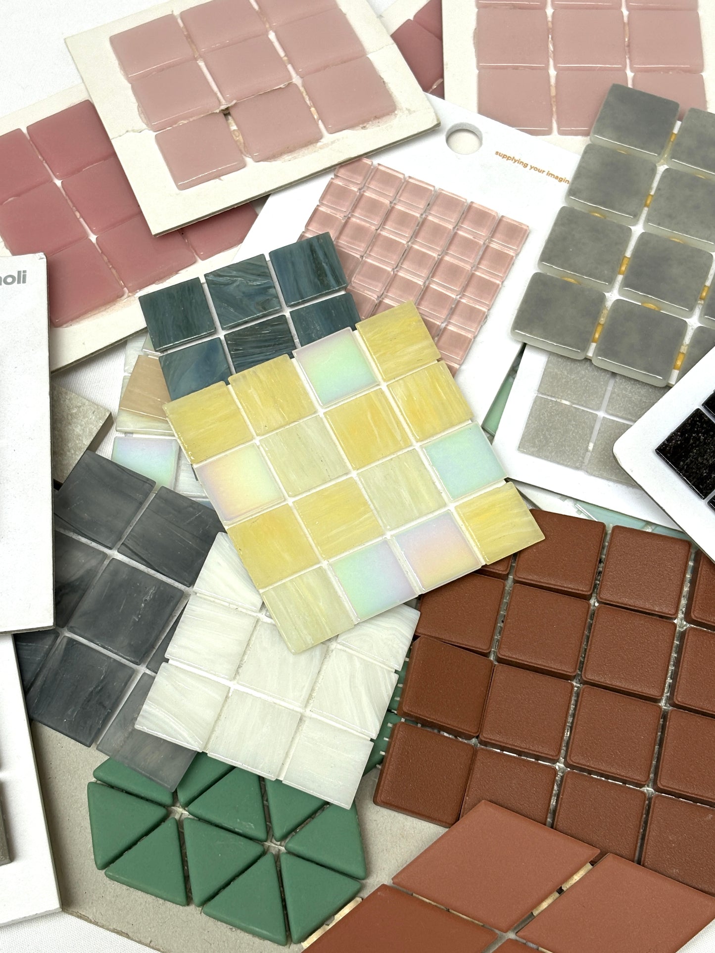 Close-up views show tile samples in different colours, shapes, and finishes