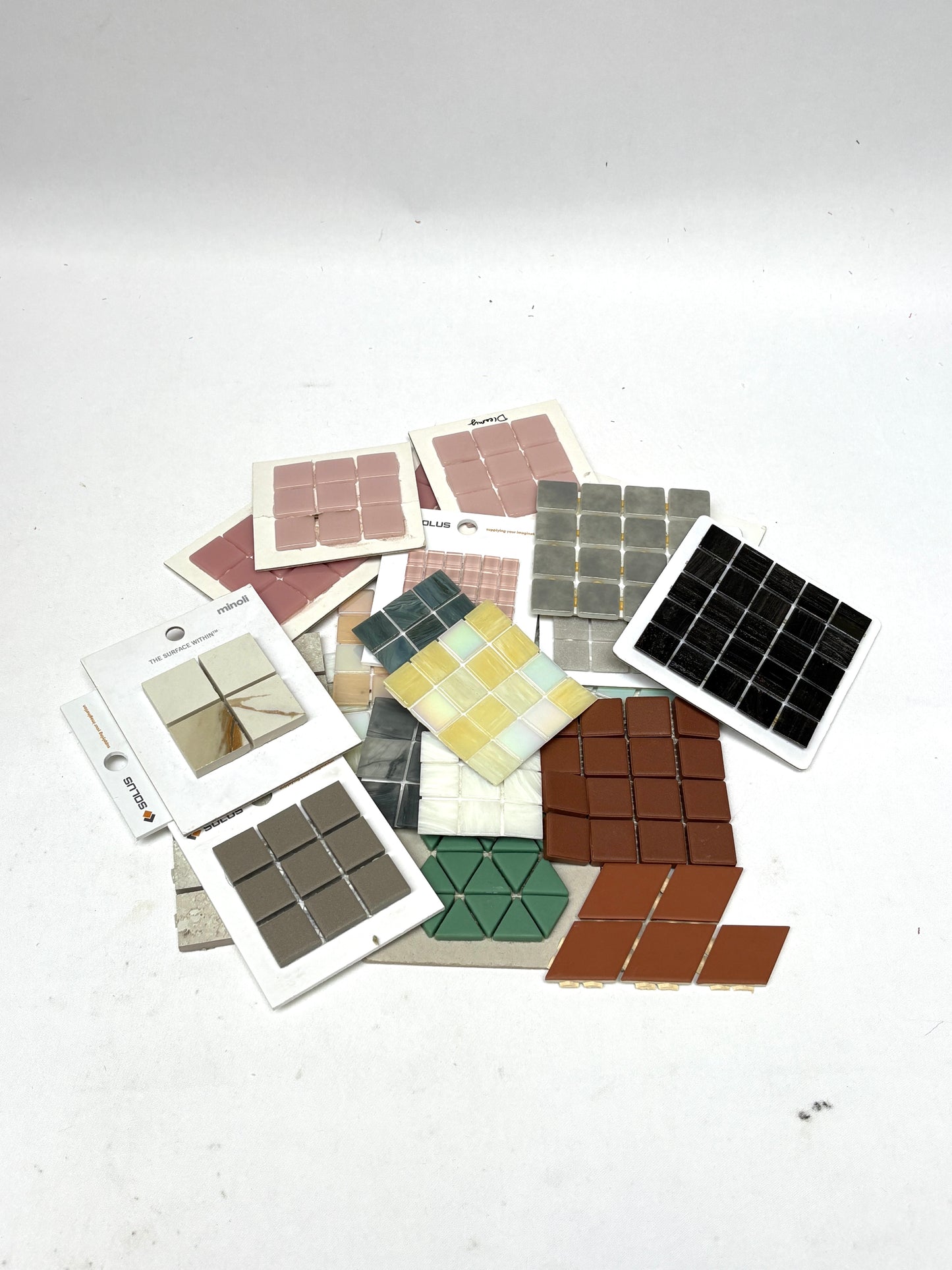 Square and geometric tile sheets are displayed in grouped arrangements