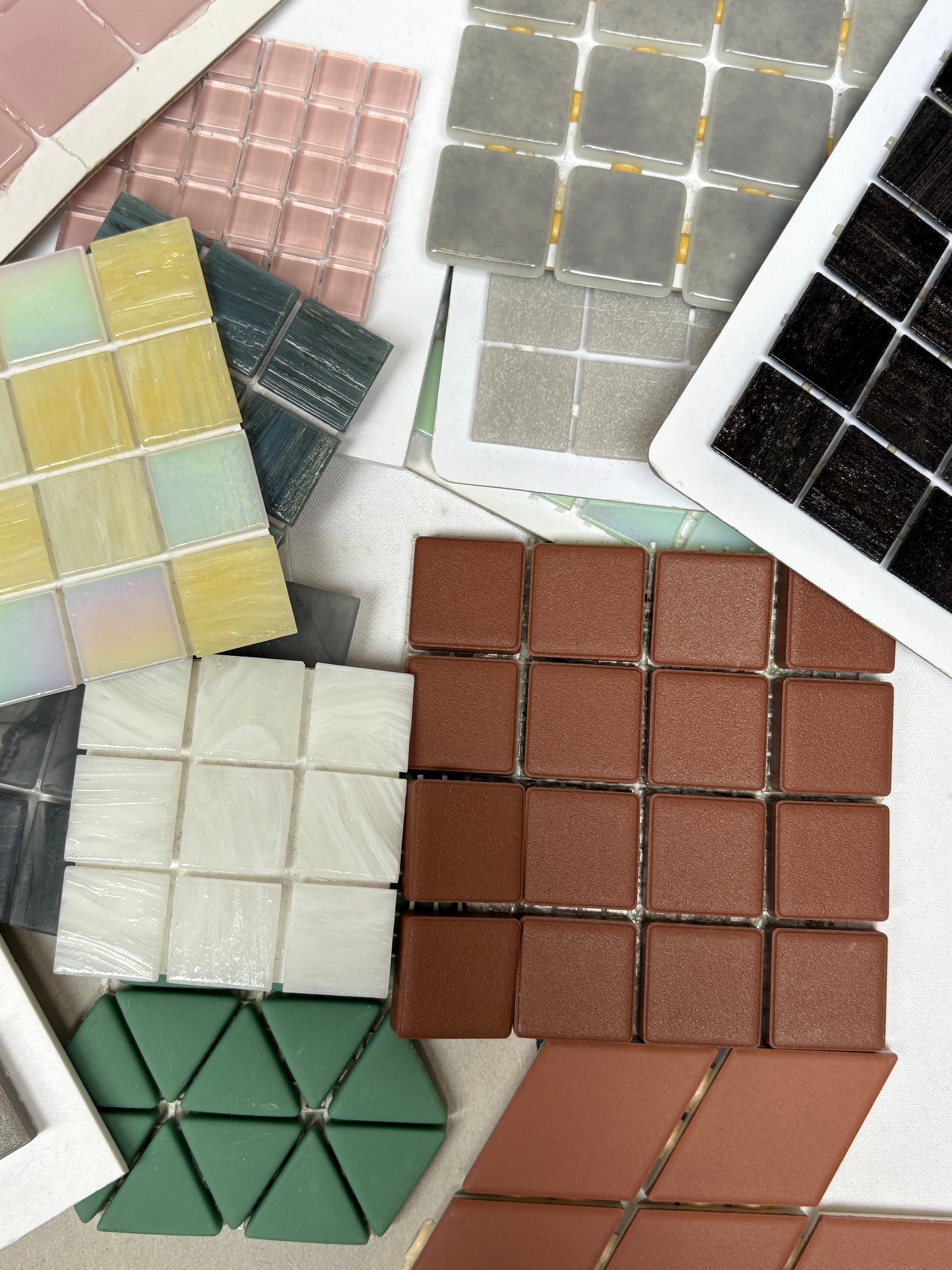 Mixed tile panels are shown in detail with glossy and matte surfaces