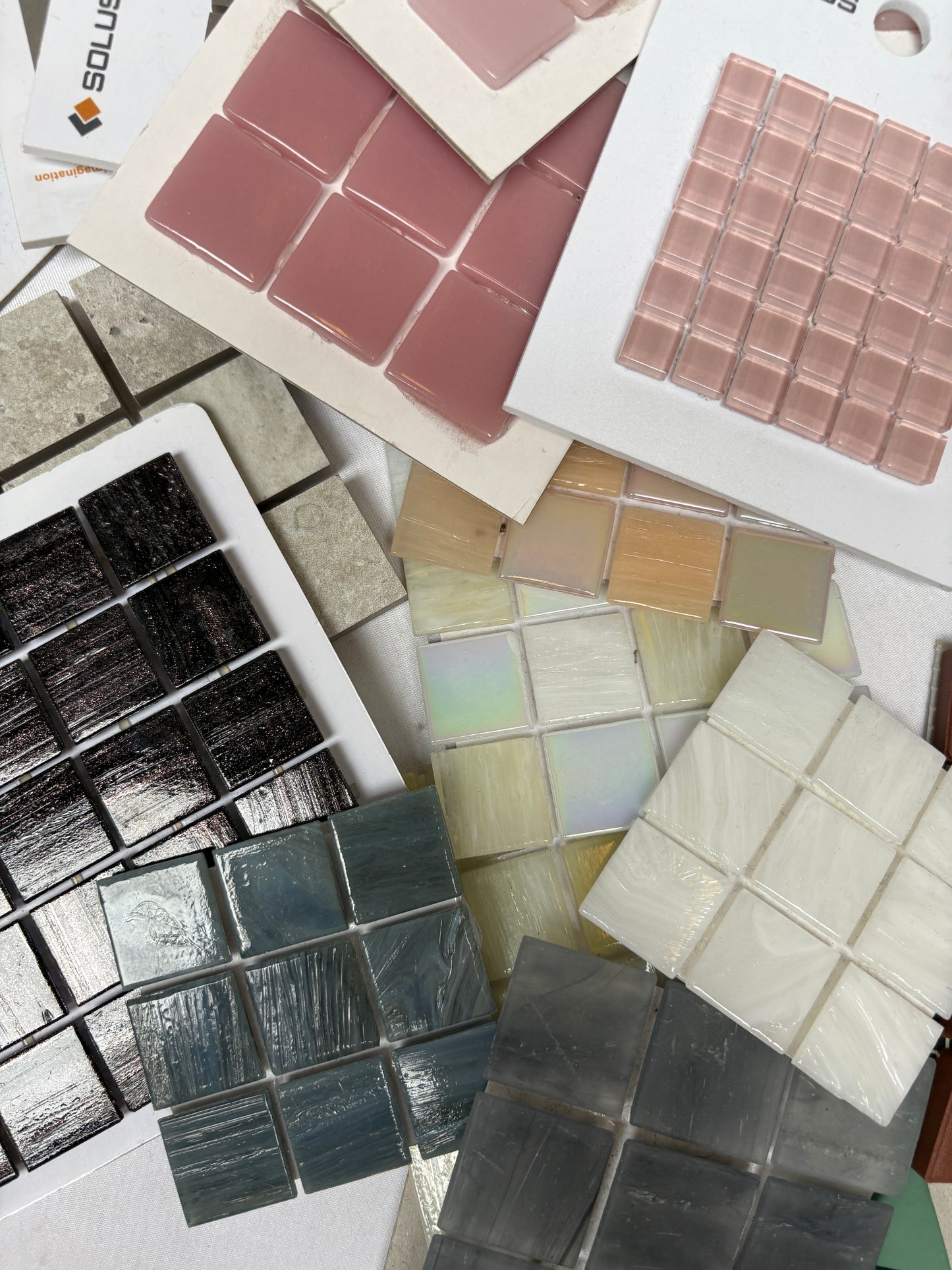 Mixed tile panels are shown in detail with glossy and matte surfaces