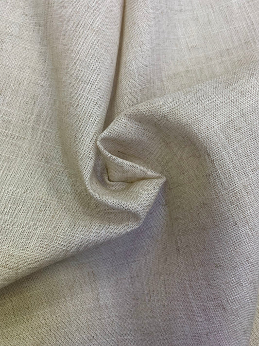 A close-up of natural coloured viscose linen deadstock fabric with a soft drape.