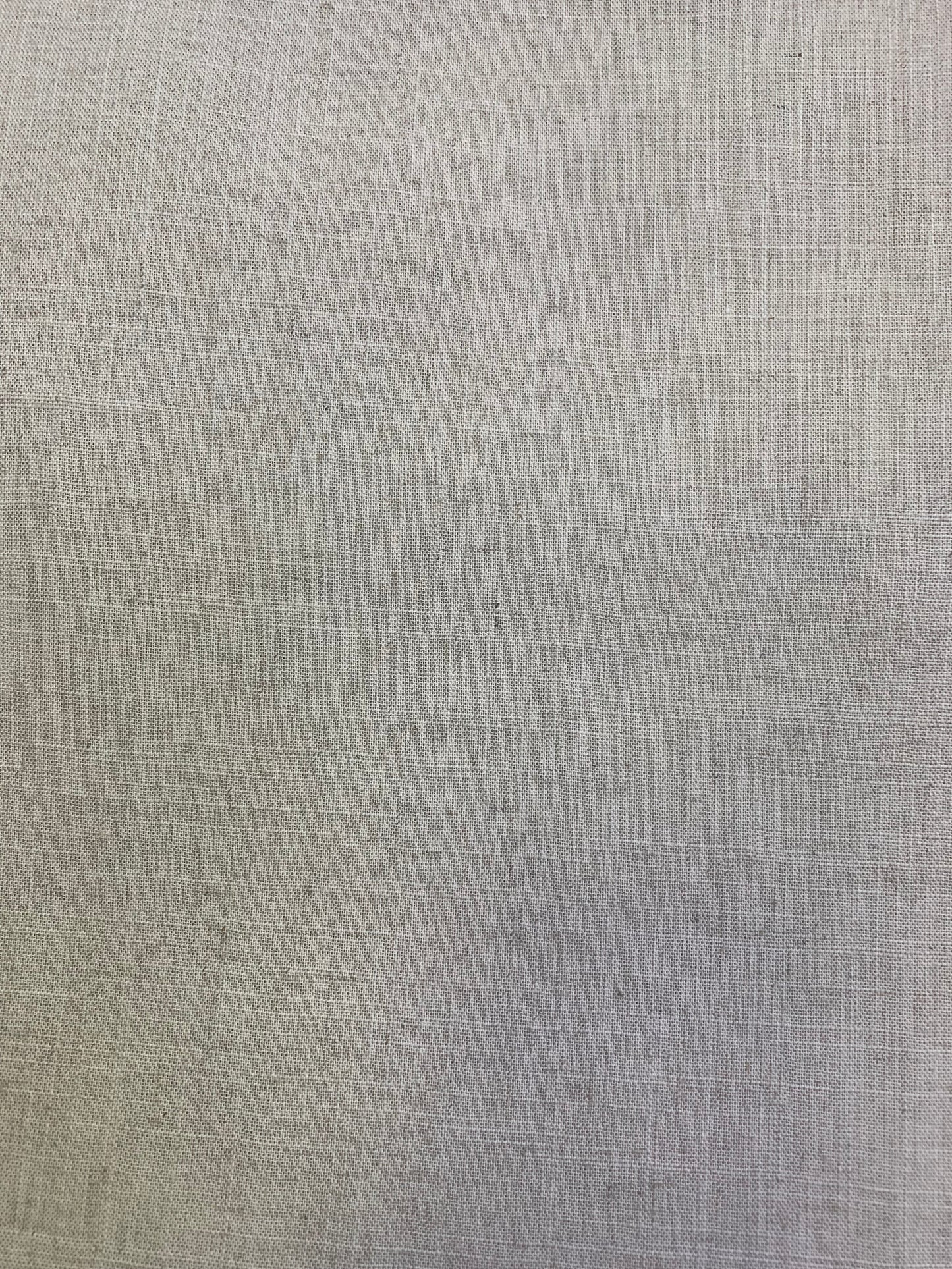A detailed view of natural coloured viscose linen deadstock fabric in a neutral tone.